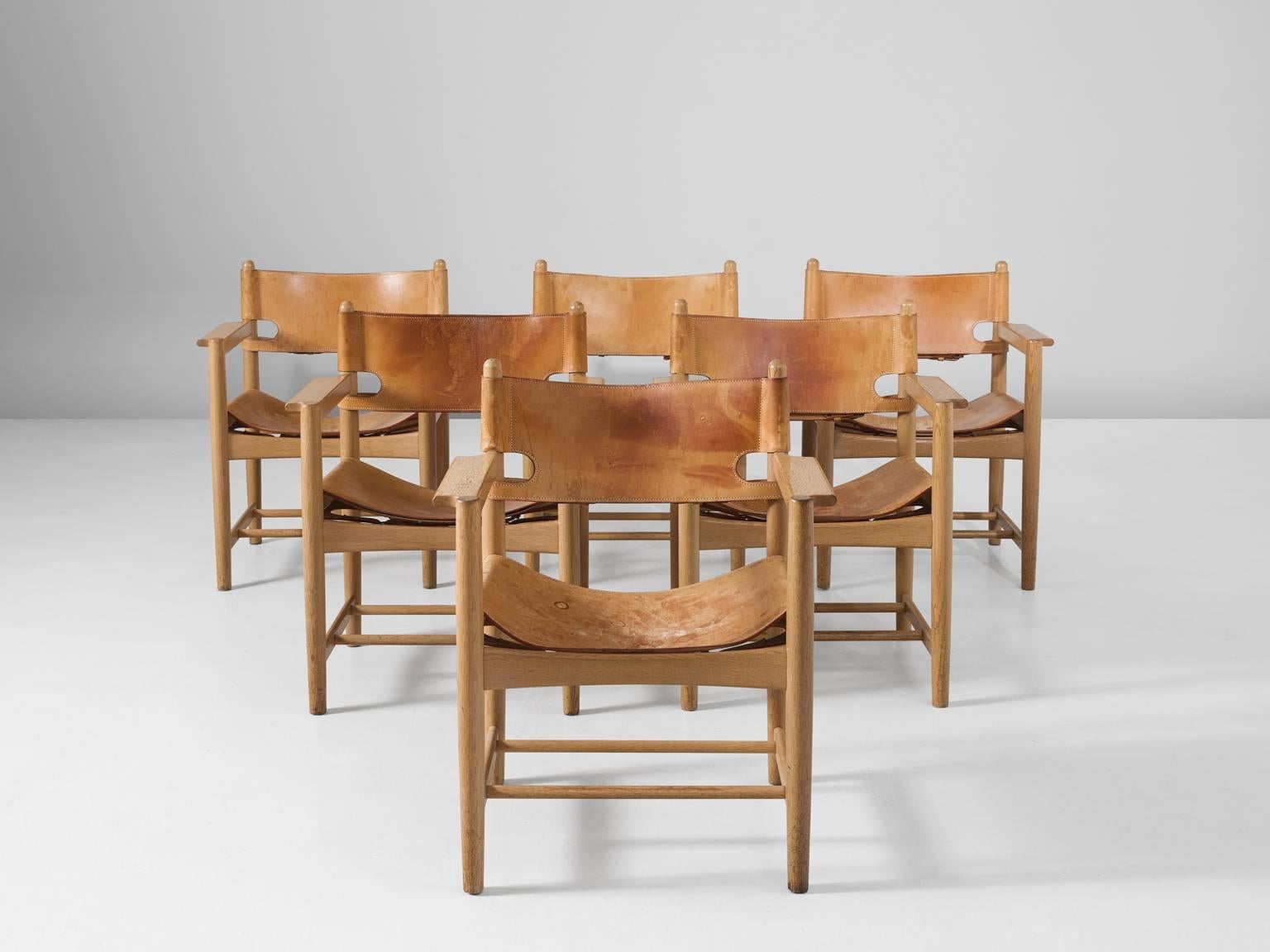 Set of six armchairs model 238, in oak and leather by Børge Mogensen for Fredericia Stolefabrik, Denmark, 1964. 

Set of six armchairs in solid oak. These chairs remind of the classical foldable 'director-chairs', yet this design by Danish designer