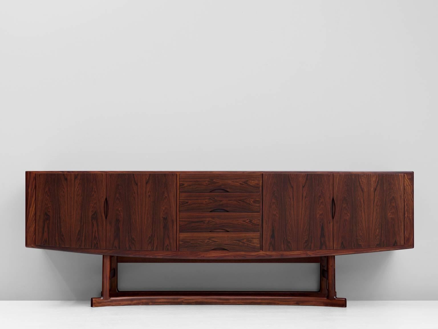 Sideboard model HB20, in rosewood, by Johannes Andersen for Bech Møbelfabrik, Denmark 1968.

Highly refined credenza in rosewood. This excellent designed sideboard shows magnificent lines. The bottom of the cabinet is nicely curved. This organic