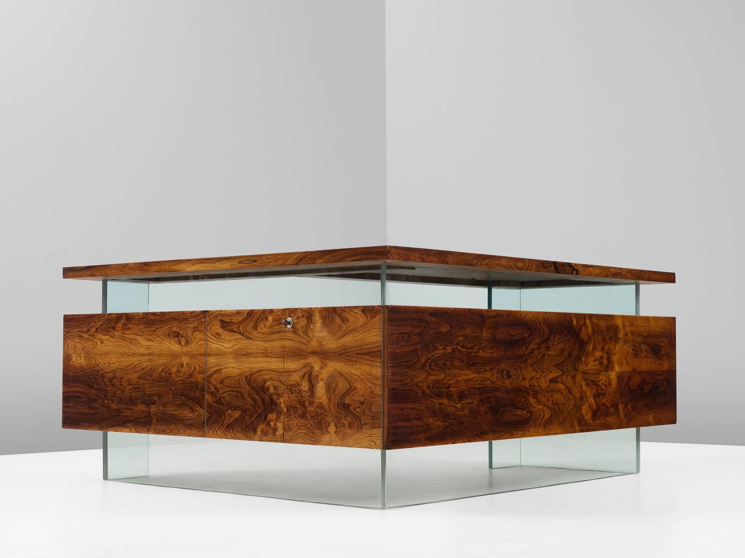 Desk, in rosewood and glass, France, 1960s. 

Large desk and return in Rio rosewood and glass. This desk originates from France. The wonderful design shows resemblance to the works of French designers like Rene Jean Caillette, Pierre Guariche