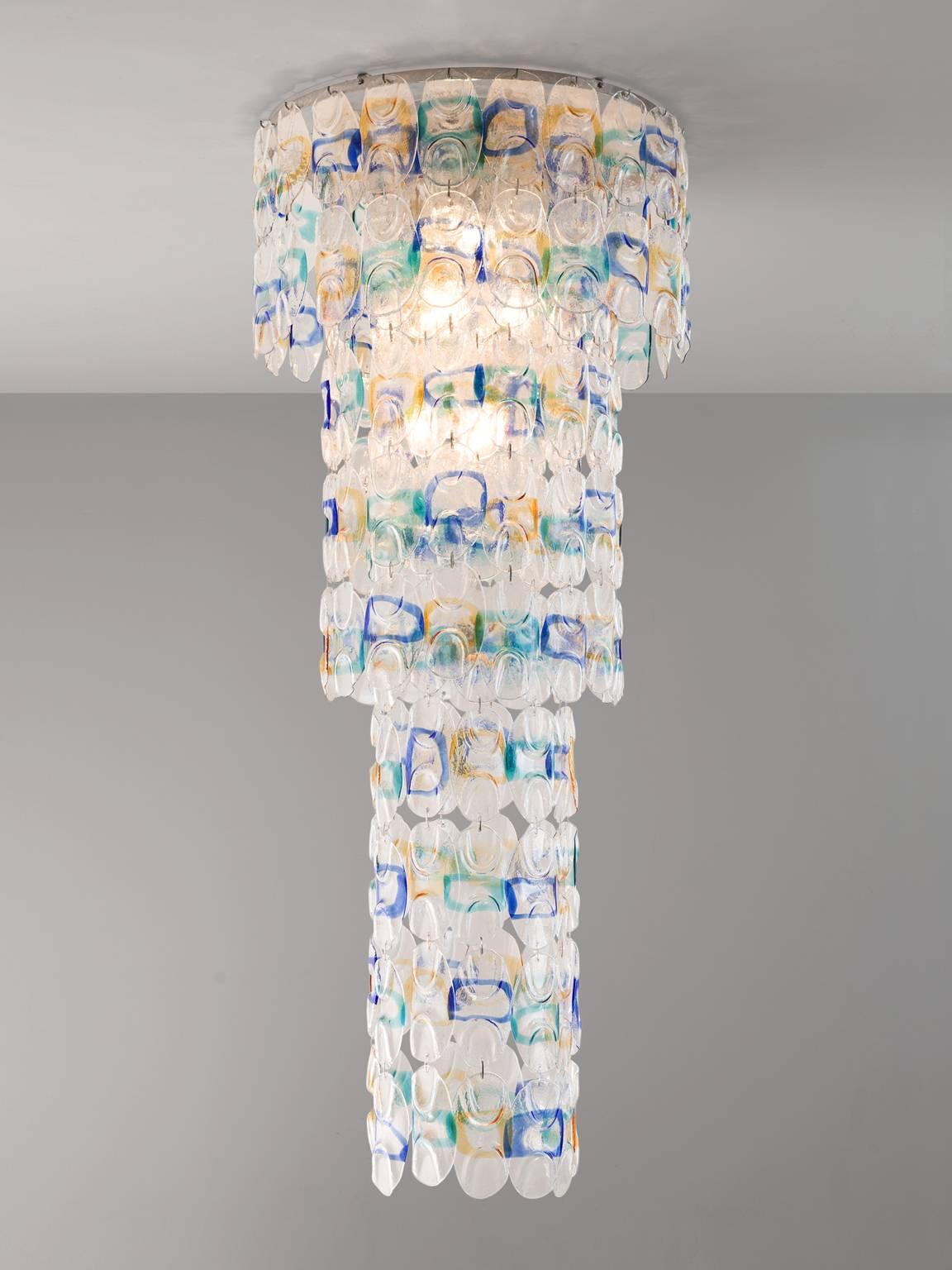 Chandelier in glass and metal for Venini, Italy, 1960s.

Stunning pair of two extra large (7.5 feet) Venini chandeliers with Murano glass. Each chandelier consist of 218 glass discs. Clear glass with a colored 'circle' on it. The glass is divided