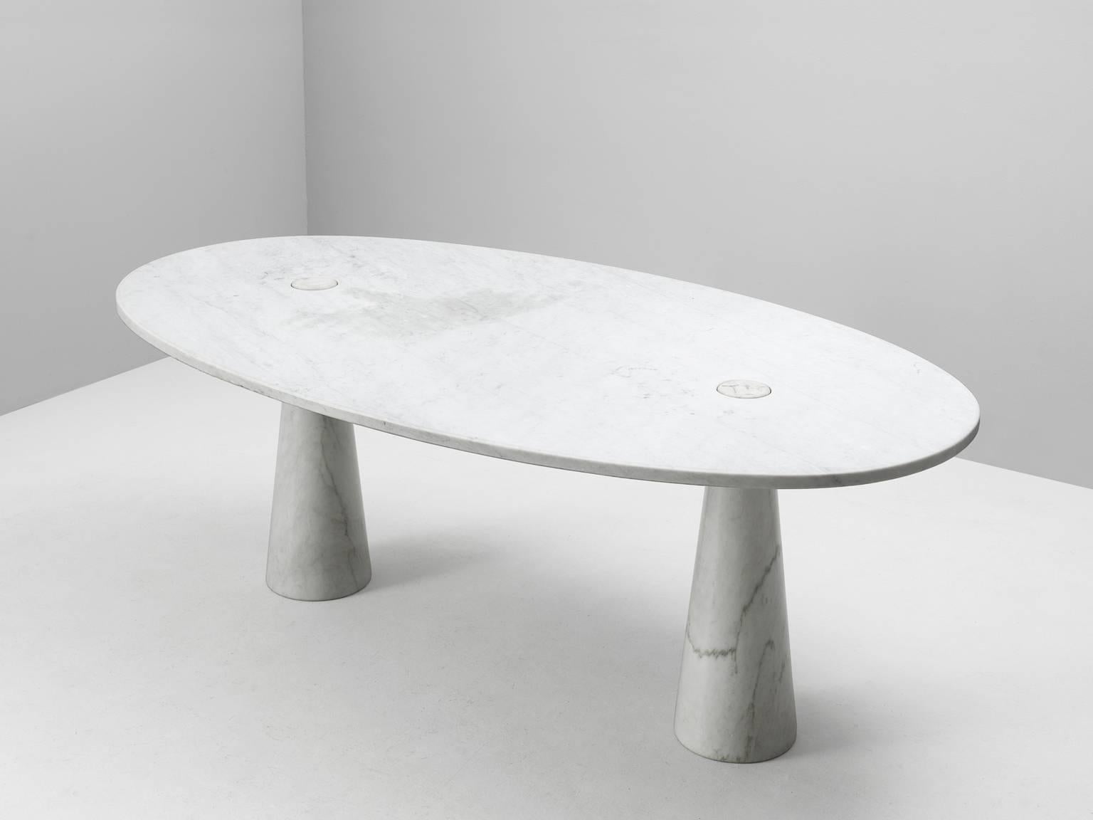 Dining table, in marble by Angelo Mangiarotti for Skipper, Italy, 1970s. 

White marble table by Italian designer Angelo Mangiarotti. This table in white Carrara marble, with oval top and two cone shaped legs is one out of a serie. This table is