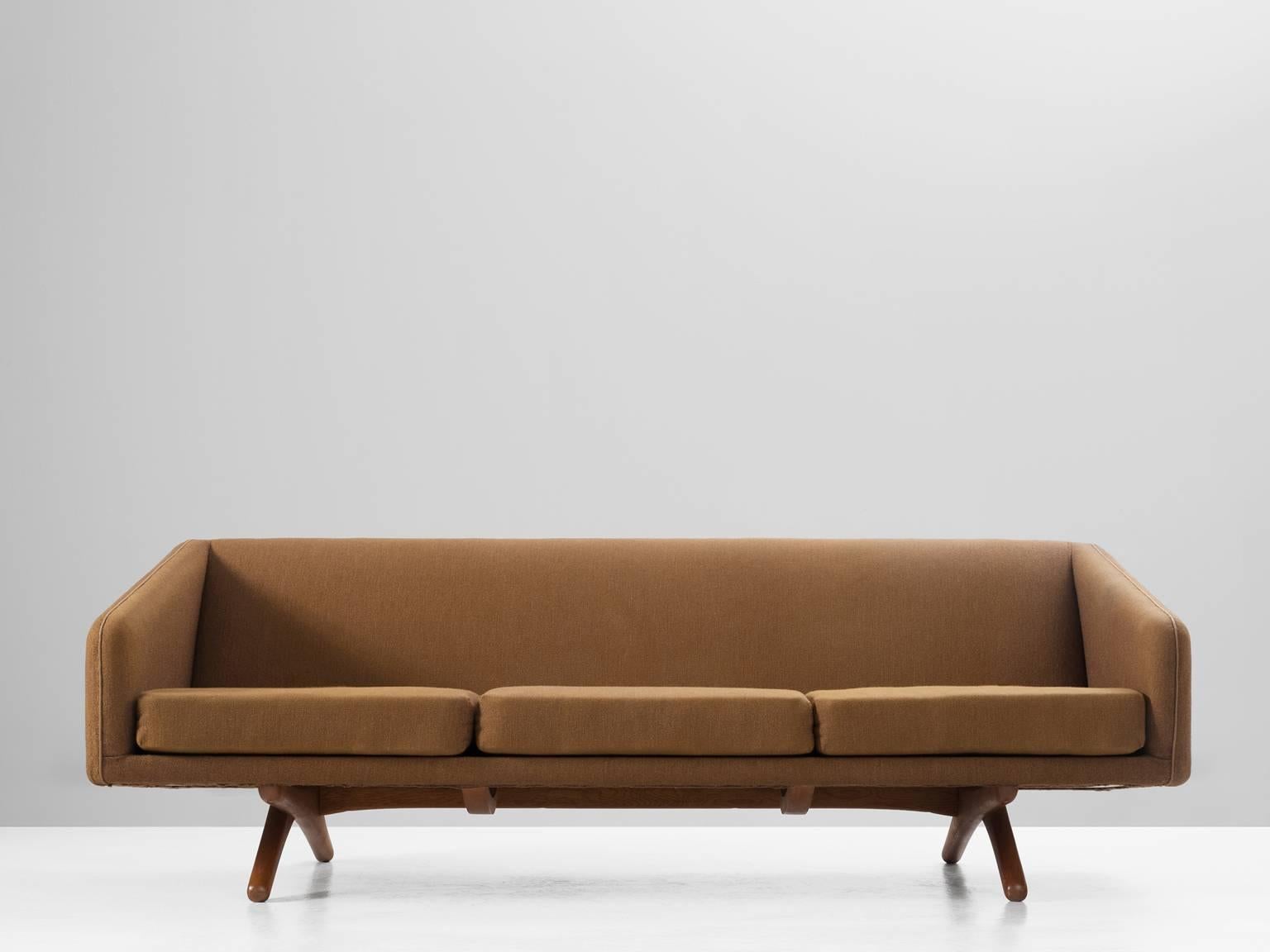 Sofa model ML-90, in fabric and oak, by Illum Wikkelsø, Denmark, 1960. 

Modern sofa by Danish designer Illum Wikkelsø. This beautiful sofa has a tight and sleek design. The seating is straight, the addition of the vertical lines creates an