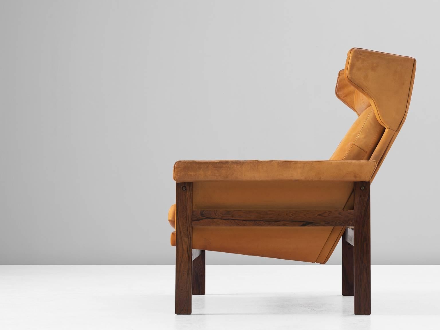 Mid-Century Modern Danish Wingback Chair in Solid Rosewood and Patinated Cognac Leather