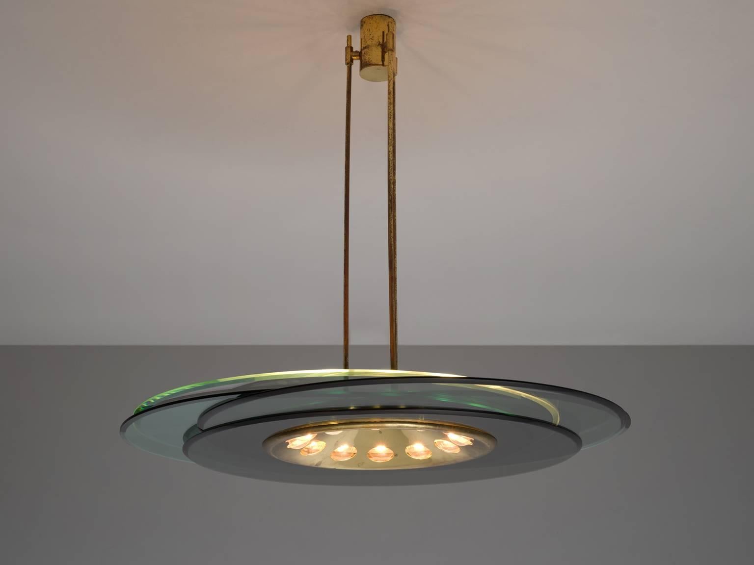 Chandelier in brass, metal and glass by Max Ingrand for Fontana Arte, Italy, circa 1955.

Unique chandelier by Max Ingrand for Fontana Arte. The fixture is made of three brass sterns, which run into a bowl shaped shade with 12 light points. The