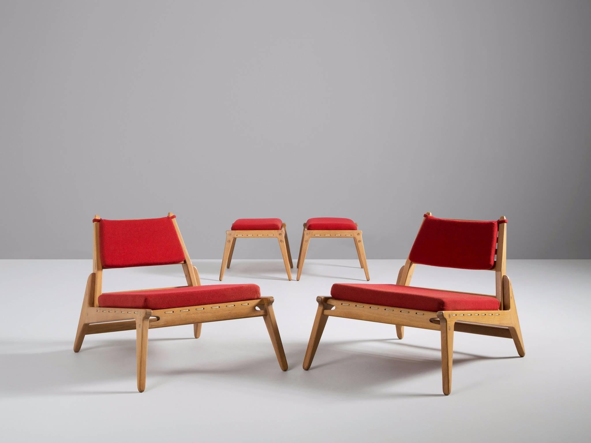 Pair of lounge chairs and ottomans, in oak and fabric, Germany, 1950s. 

Set of two modular chaise longues. These relaxing hunting chairs show a basic minimal design with great woodworking. A great open character is created by the high legs and