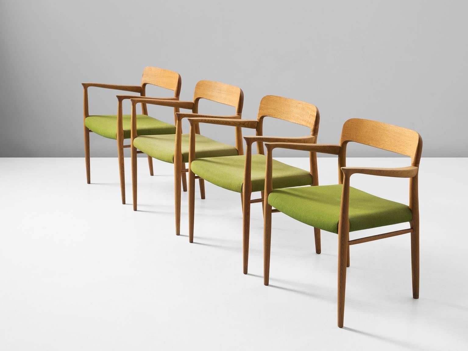 Set of two dining chairs model 56, in oak and fabric, by Niels Otto Møller for J. L. Møller, Denmark, 1954. 
 
This set of chairs shows subtle lines and beautiful curves of the woodwork.
In the highly refined connections of the wood you can see the