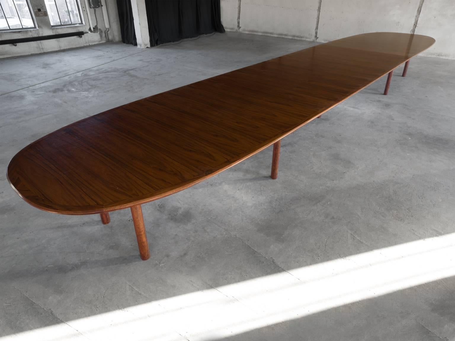 Dining table, in rosewood, Denmark, 1950s. 

Extremely large table from almost 8 meters. Executed in rosewood with beautiful expressive grain. The design makes sure all attention goes to the beautiful and natural material. By the use of only nine