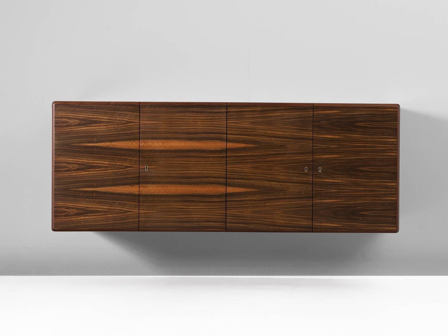 Wall-mounted sideboard in rosewood by Jos De Mey, Belgium, 1960s. 

Modern and sleek wall-mounted credenza by Belgium designer Jos De Mey. A four door cabinet with beautiful rosewood veneer. The grain of the wood on the front is absolutely