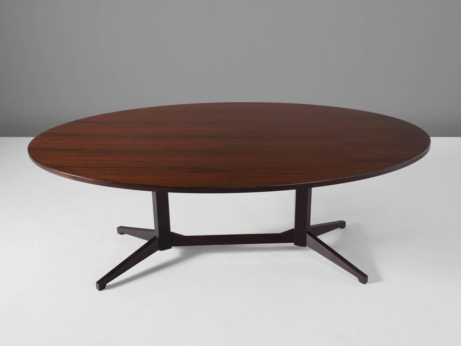 Dining table TL22, wood, by Franco Albini for Poggi, Italy, 1958.

Oval dining table in darkened wood. . The frame consist of two lcolumns with a cross connections. Each column holds two legs in the shape of a V. The base creates a nice open