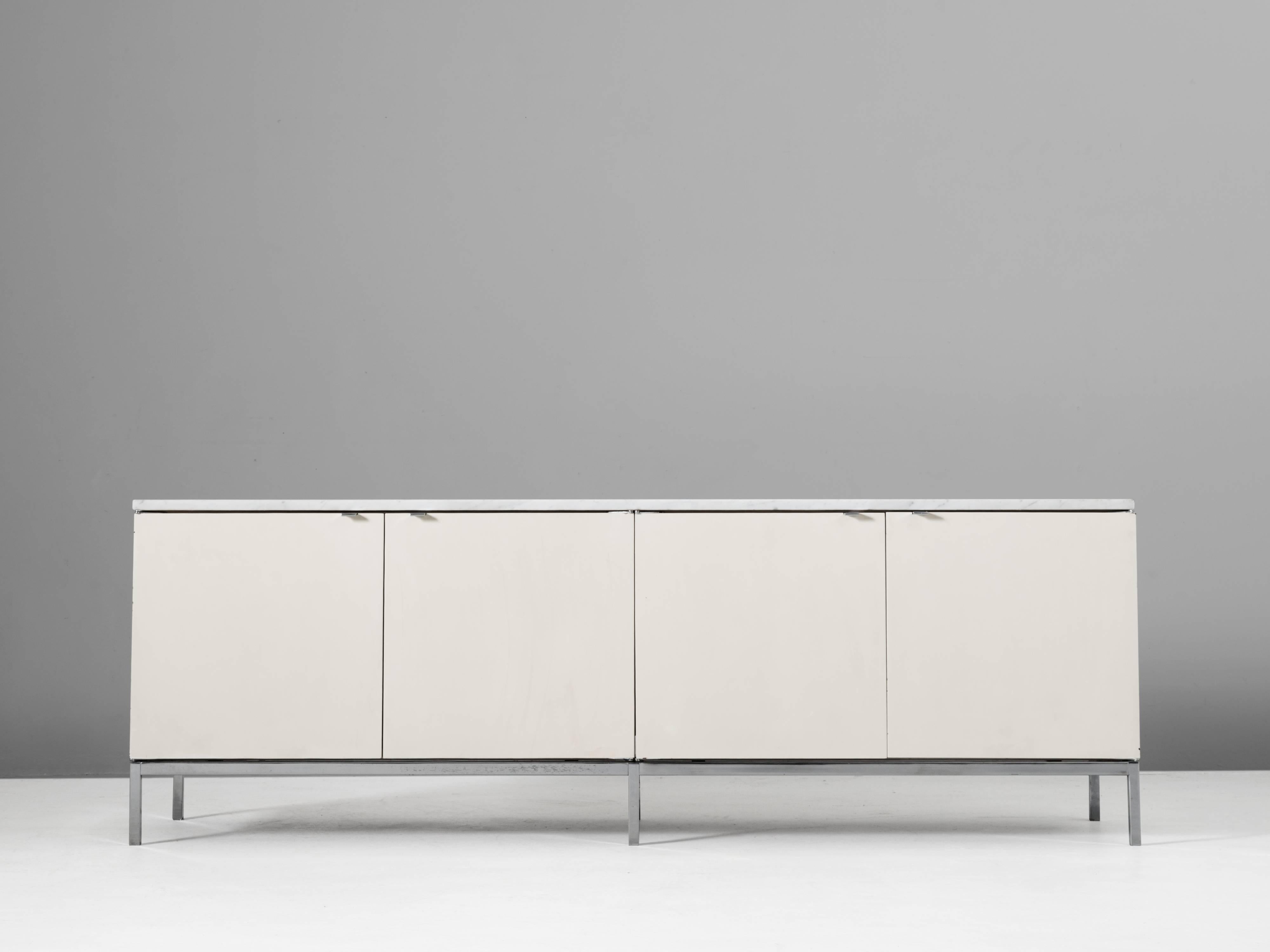 Sideboards in oak metal and marble by Florence Knoll for Knoll International, United States, 1960s. 

Freestanding minimalistic credenza with elegant details such as the chromed base and marble top. Equipped with smart storage facilities. This