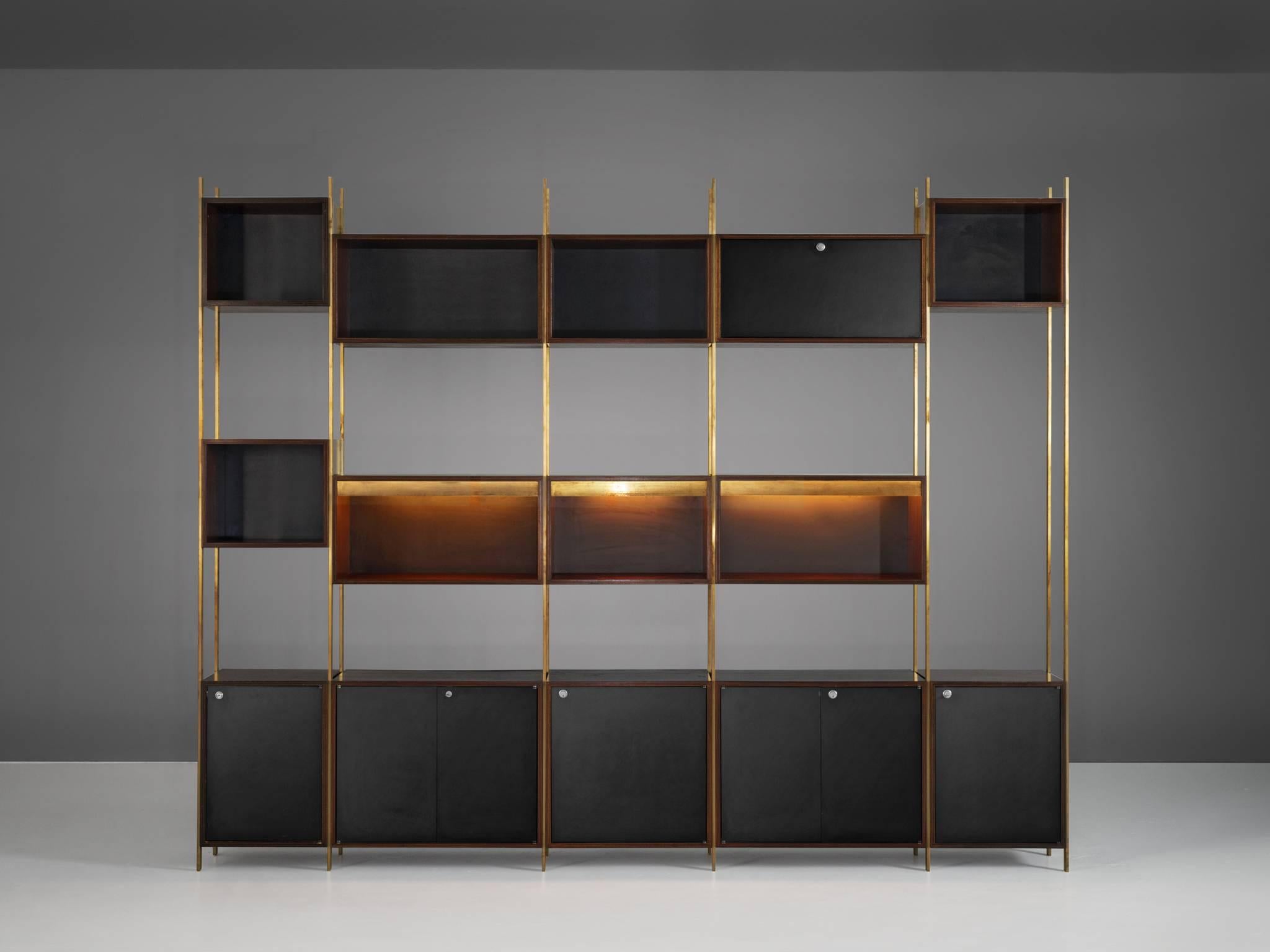 Bookcase, in brass and rosewood, by Jules Wabbes for Mobilier Universel, Belgium 1960s.
 
Rare wall unit designed with the highest precision in furniture making by master furniture-maker Jules Wabbes. This cabinet could be used as a library and room
