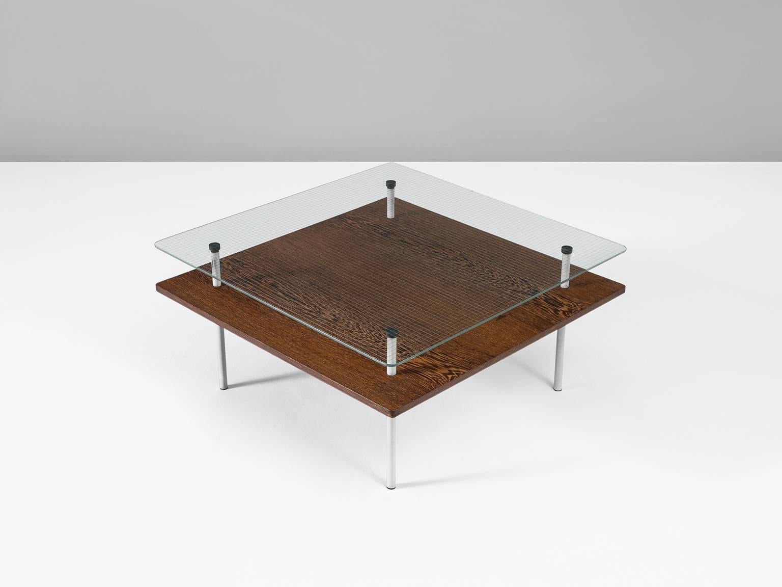 Coffee table in wengé metal and glass by Elmar Berkovich for Metz & Co., the Netherlands, circa 1935.

Modern cocktail table by designer Elmar Berkovich for the Dutch company Metz & Co. An interesting combination of materials is used to make this