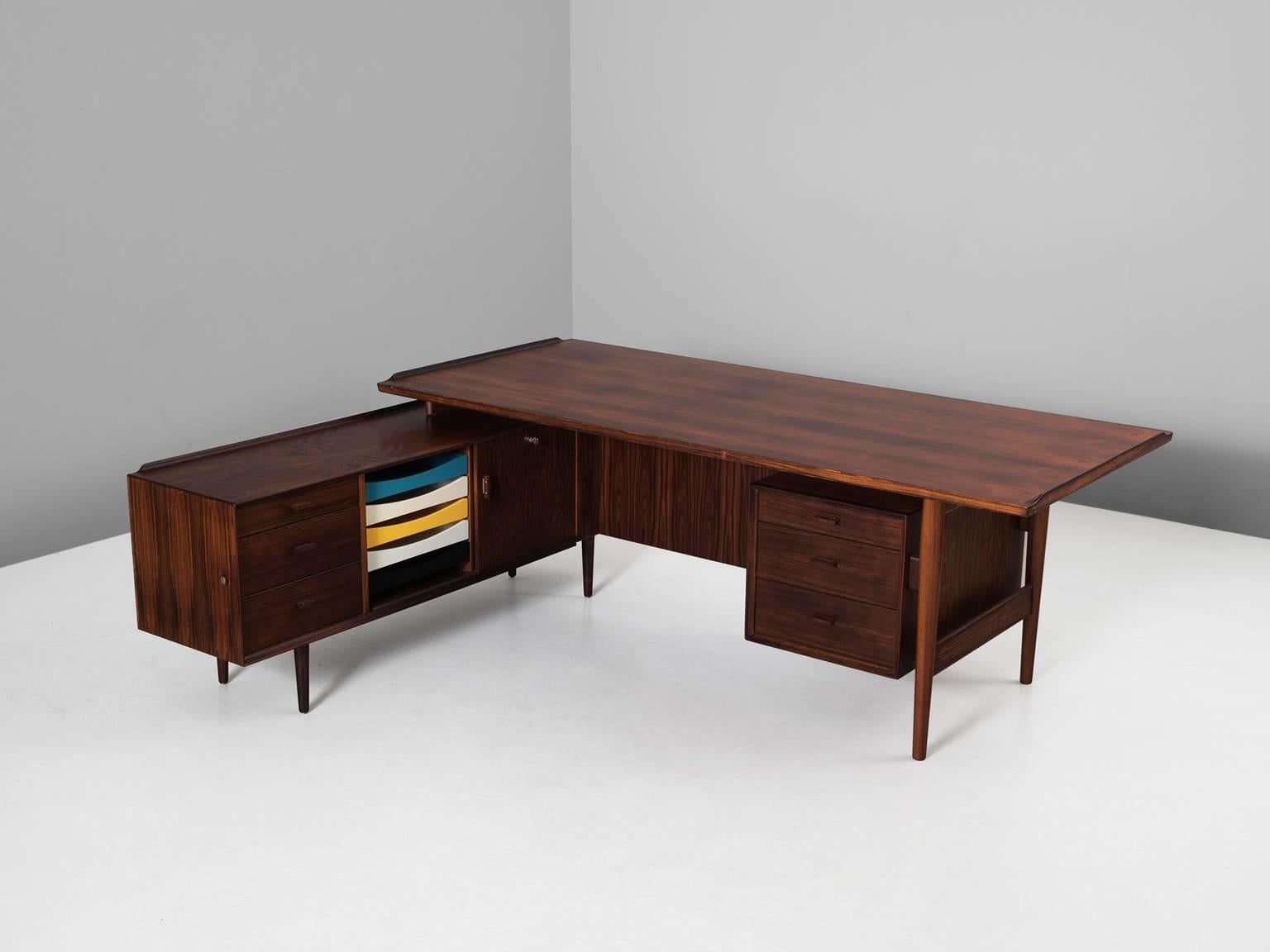 Executive desk, in rosewood, by Arne Vodder for Sibast Møbler, Denmark 1950s. 

Rosewood executive desk. This luxurious piece was designed by one of the best designers Denmark has known and was produced by Sibast. Vodder designed a large series of