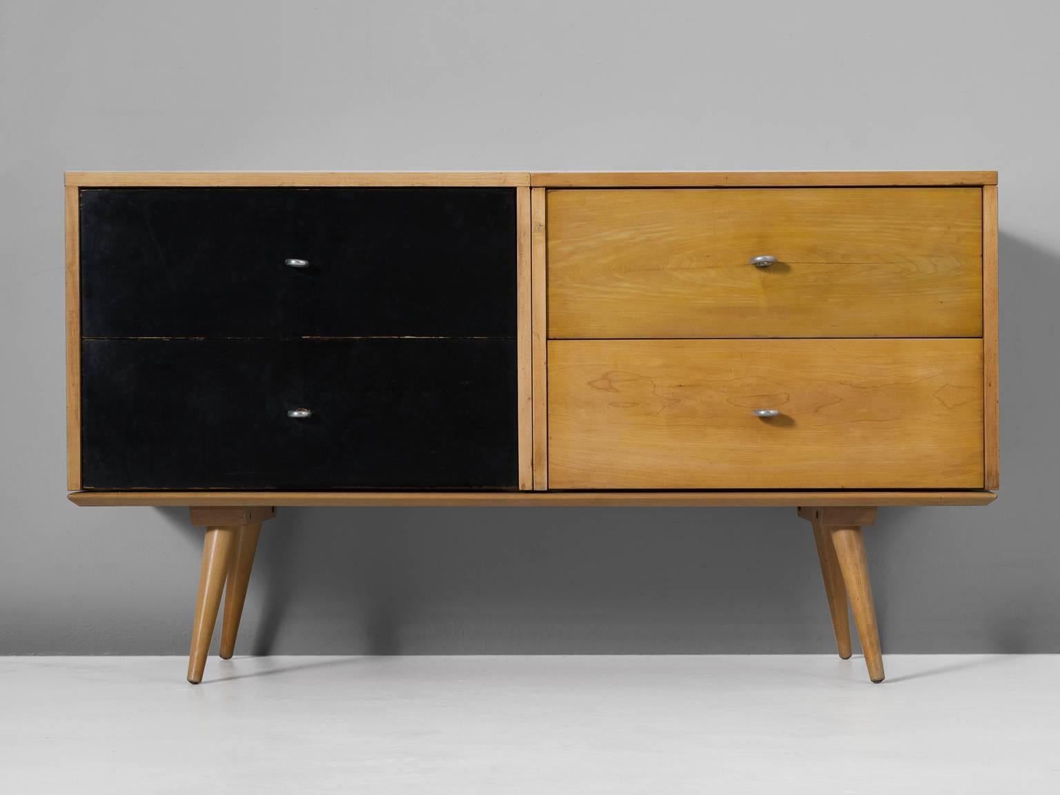 Paul McCobb small sideboard in maple, United States, 1950s.

This cute maple sideboard is easy one the eyes and seems solid in it's appearance. However, black and white could also be white and black as these cabinets are separate elements and can