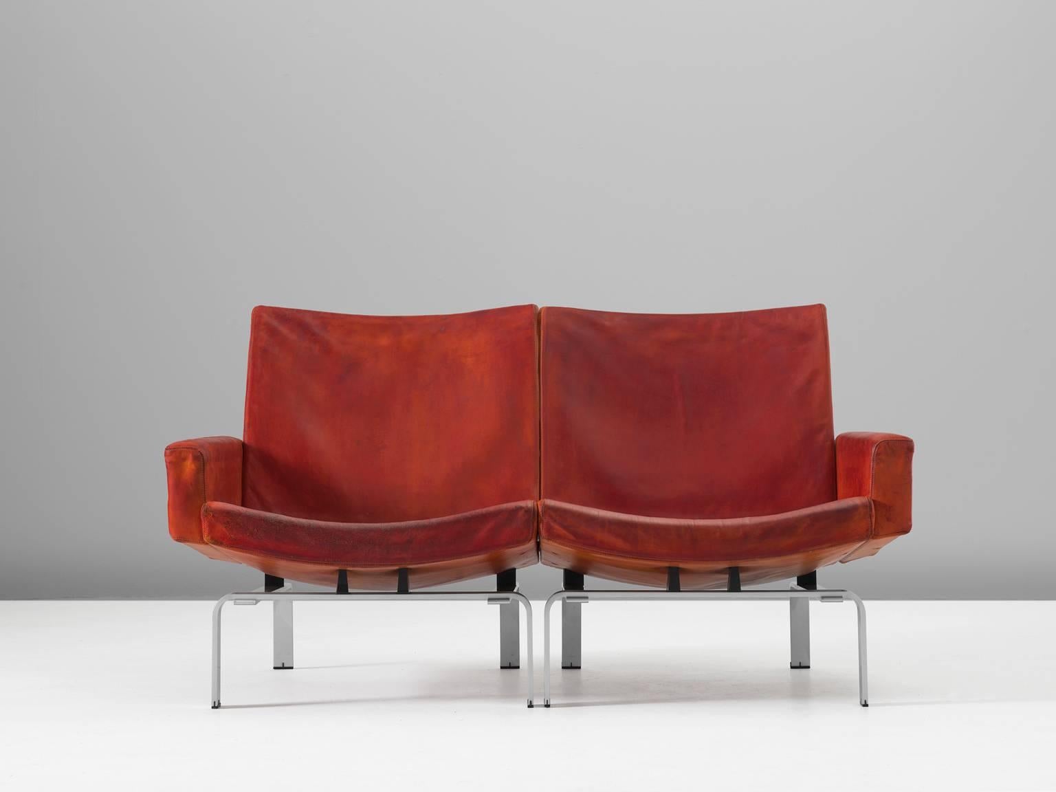 Very exclusive cognac sofa designed by Jørgen Høj, who worked in the same atelier together with Poul Kjaerholm. 

Highly extraordinary design. Sofa is placed on a well formed aluminium frame which are recognizable for the designs of Høj. The