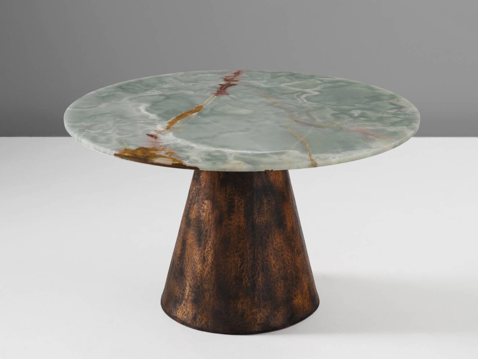 Dining table, onyx and copper base, Italy, 1970s.

This table is in the style of Angelo Mangiarotti (1921–2012). His designs are solid and strong and he always used materials that will stand the test of time. The most striking feature of this table