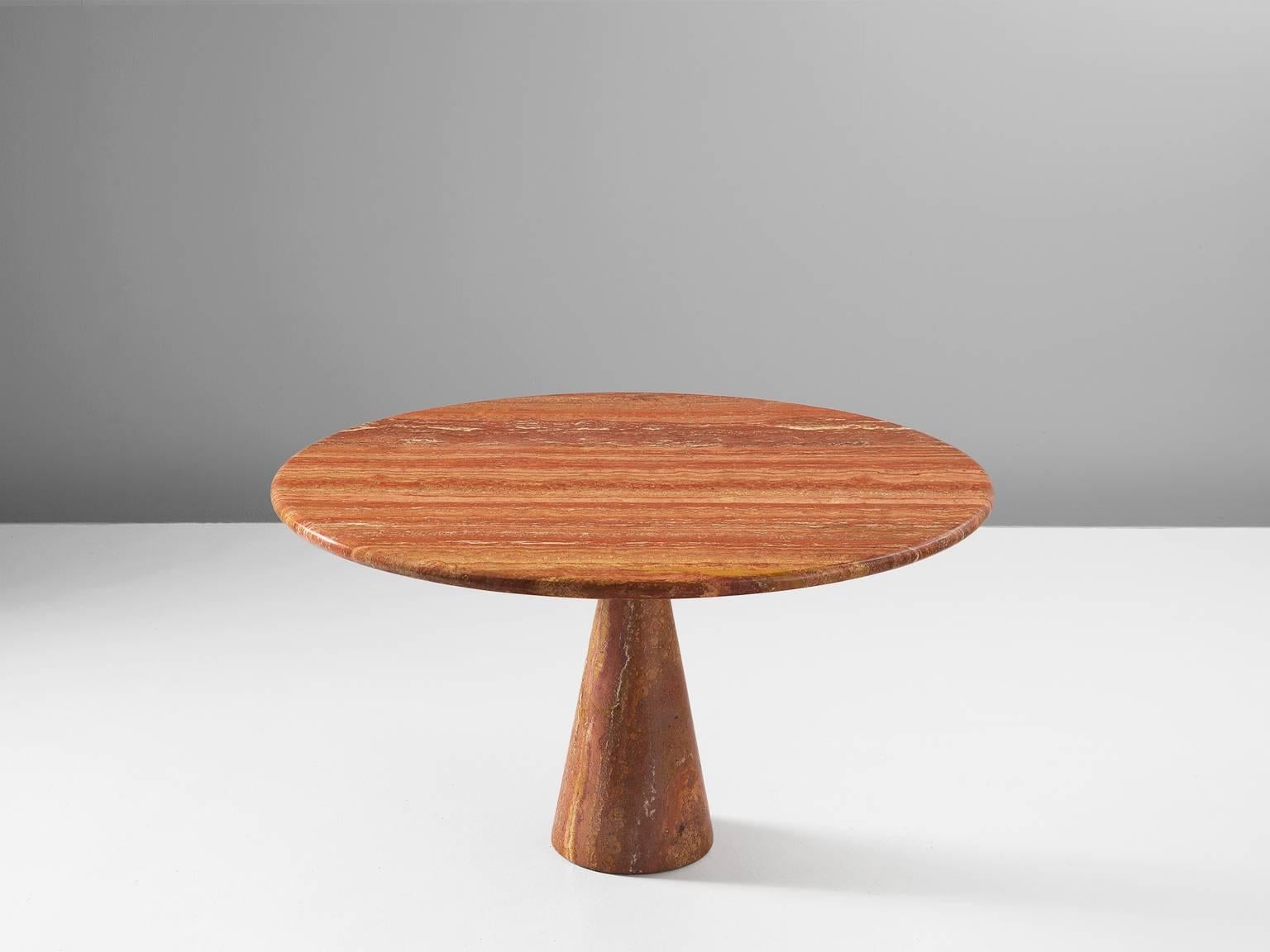 Dining table, red travertine, 1969 by Angelo Mangiarotti and made by the company T70, Italy. 

Angelo Mangiarotti (1921-2012) was an Italian architect and Industrial designer with a reputation to mainly focus on the needs of the users of furniture.