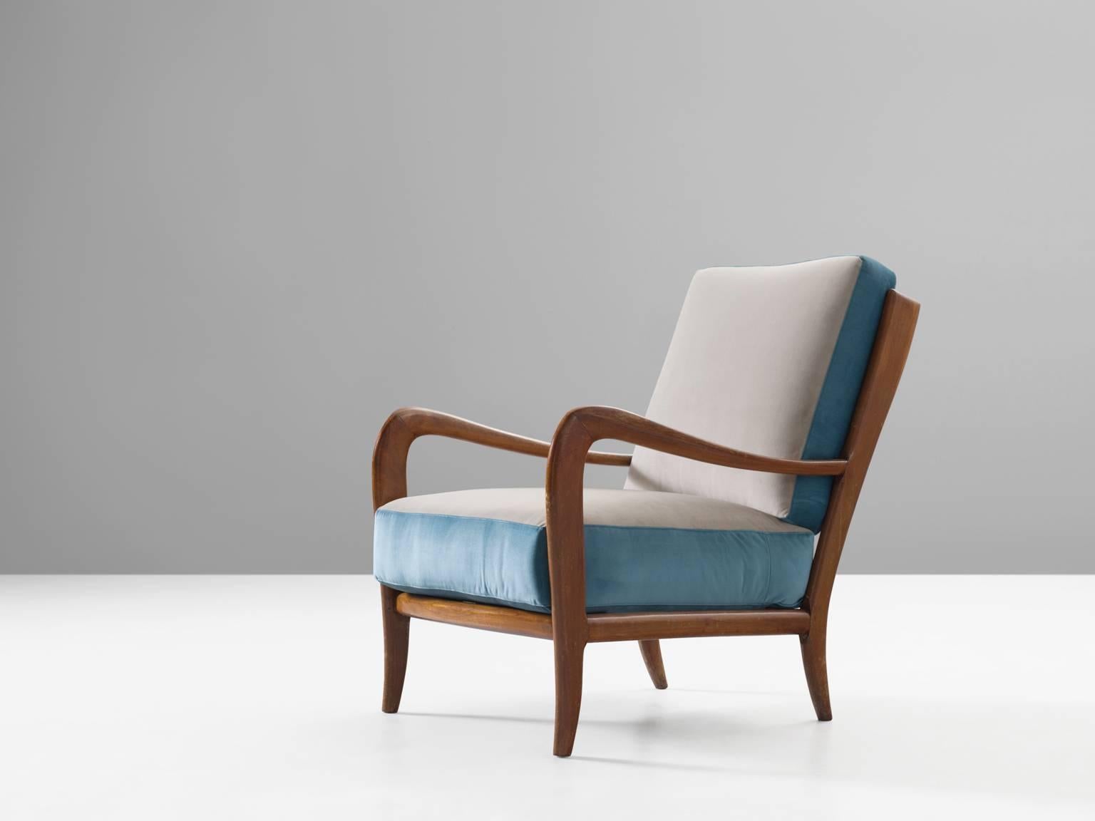 Chair, Italian walnut and fabric, 1960s, Italy.

This poetic armchair is made in the style of Paolo Buffa (1903-1970). The chairs are luxurious in their look and feel and thanks to their slightly tilted back, extremely comfortable. The grains in the