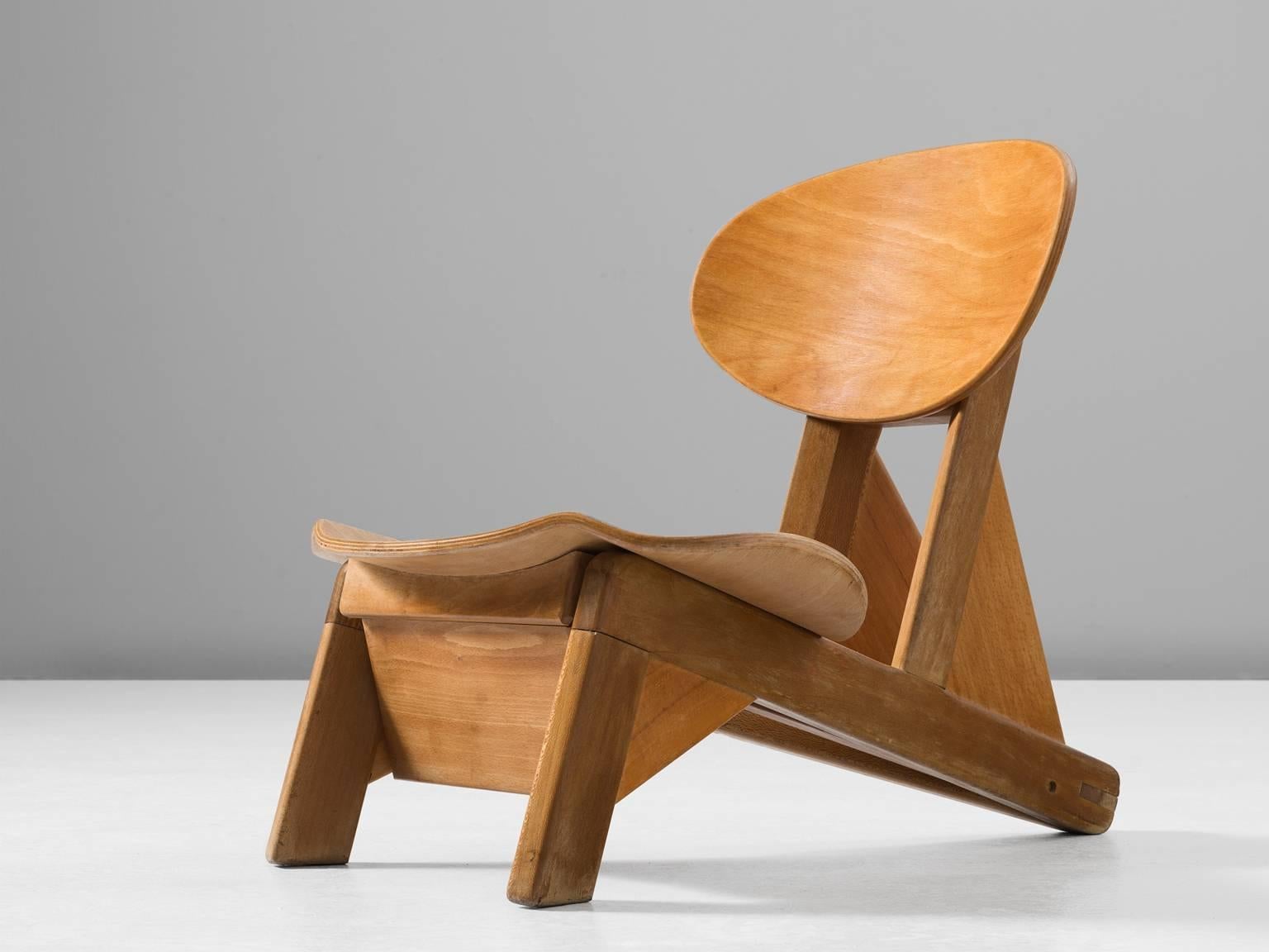 Small chair by Alain Gaubert, beech and elm, France, 1950s. 

This small and adjustable chair is by the designer Alain Gaubert. The form of this chair is truly unique as the curved seat is rare for the designs of Gaubert. This early design by