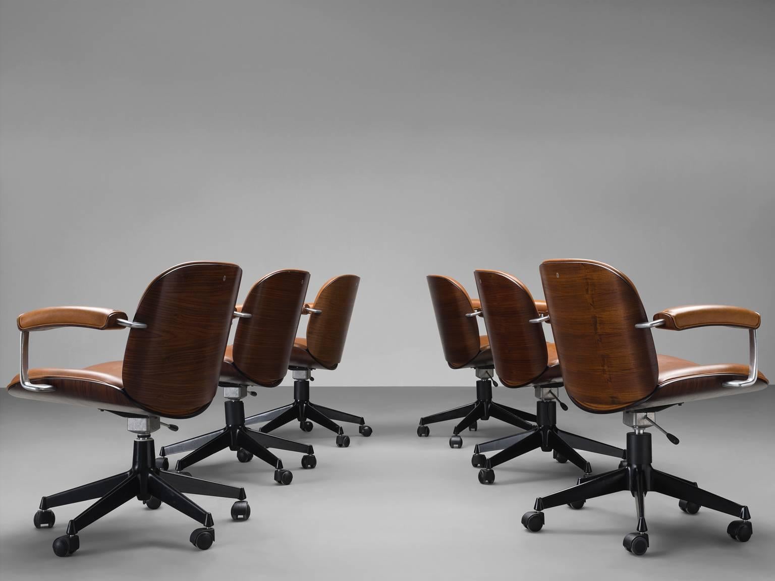 Office chairs, in metal, faux-leather and walnut veneer by Ico Parisi for MIM Roma, Italy, 1950s. 

Swivel conference chair from the 'Terni' series of Ico Parisi for MIM Roma. This chair has the characteristic shell of Ico Parisi. Seating and back