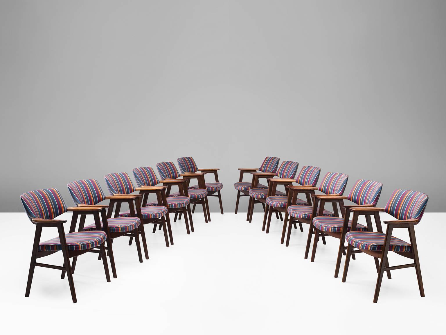 Set of 12 armchairs, in rosewood, Denmark, circa 1952.

Very comfortable dining chairs, due to well-shaped armrests and ergonomic proportions of the back and seat. The sculptural back is very attractive, as the beautifully curved bottom of the back