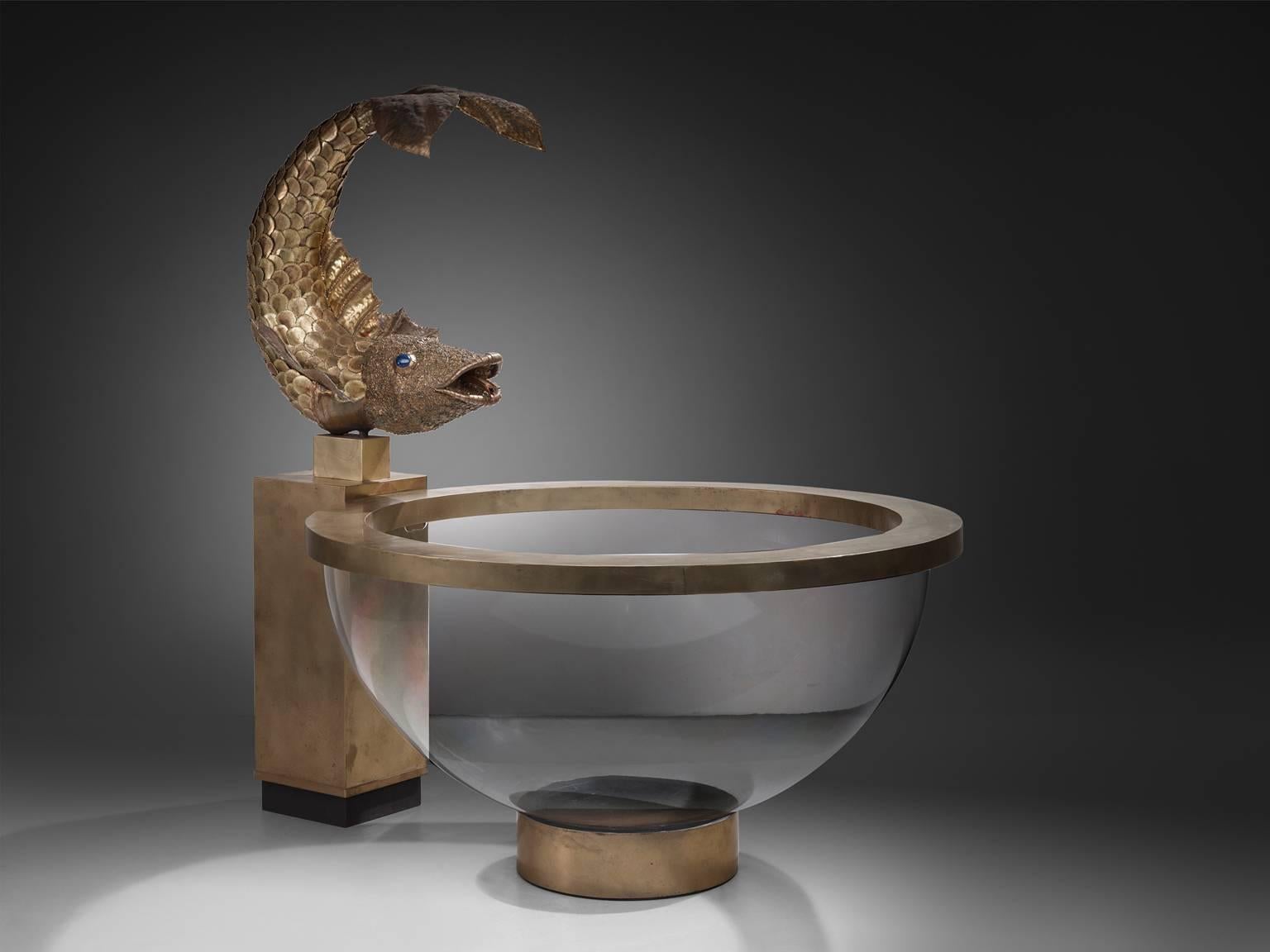 Luxurious fish fountain in brass and Lucite, France, 1960s

This unique and rare item most likely originates in France, circa 1960s. 
The refined details of the brass fish clearly show the work of a true artist. Placed on a brass plated console, the