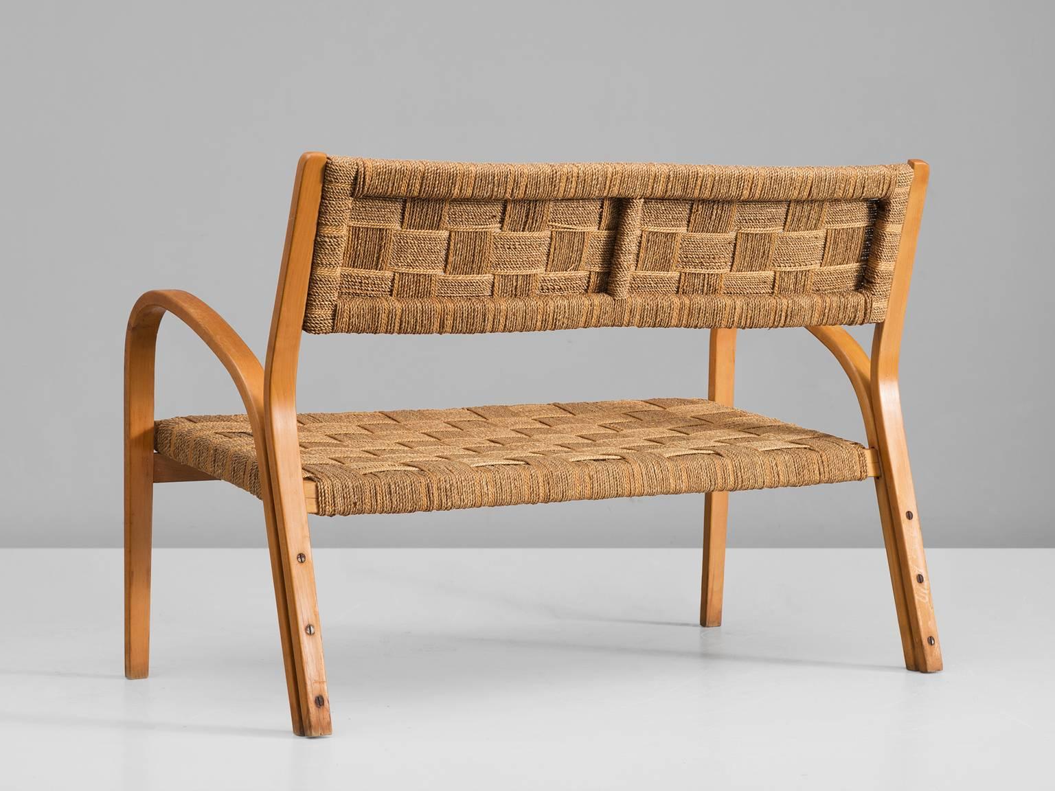 Sofa attributed to Giuseppe Pagano, curved wooden structure coated rope, Italy, 1940s.

This sofa is executed in wood and coated rope. The design of this Italian sofa is Minimalist yet not in a Puritan way. The armrests seem to rise upwards and are