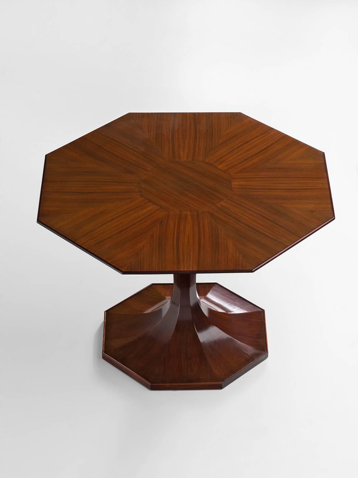 Table, walnut, by Luigi Massoni, Italy, 1950s. 

Octagonal pedestal dining table by Italian designer Luigi Massoni. Extremely well detailed in lining of the table, the inlay of the walnut and the sharped lines in the pedestal feet. The excellent