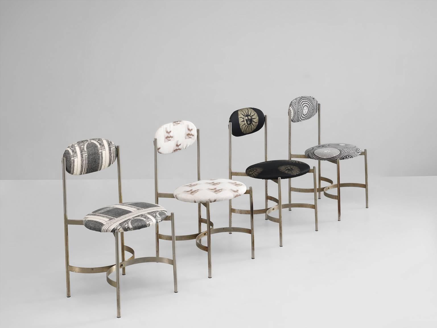 Set of four chairs, metal, fabric, Italy, 1970s.

This set of four sculptural chairs are upholstered with fabric by Fornasetti. The frame is mostly straight and Minimalist in its design. Yet the opposed connecting semicircle steels slabs show