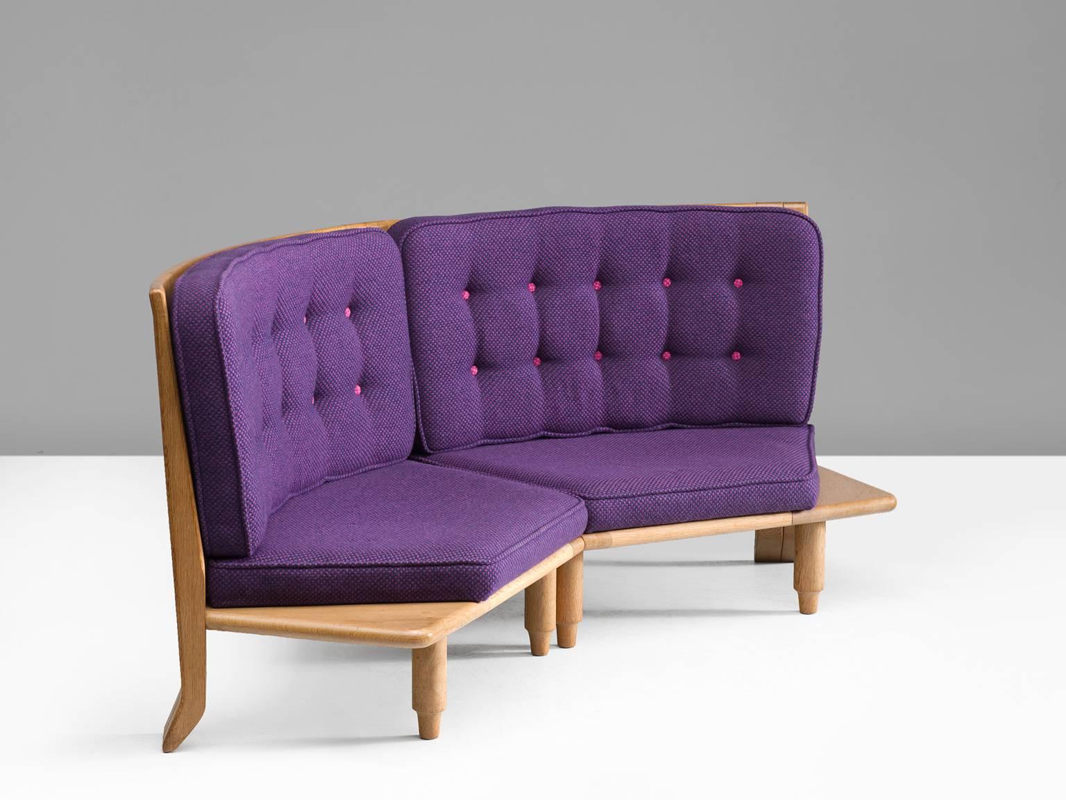 Guillerme & Chambron, sofa in fabric and oak, 1940s, France.

These distinctive chairs in beautifully patinated oak are by the French designer duo Jacques Chambron & Guillerme. This high back settee in solid oak shares the typical decorative details