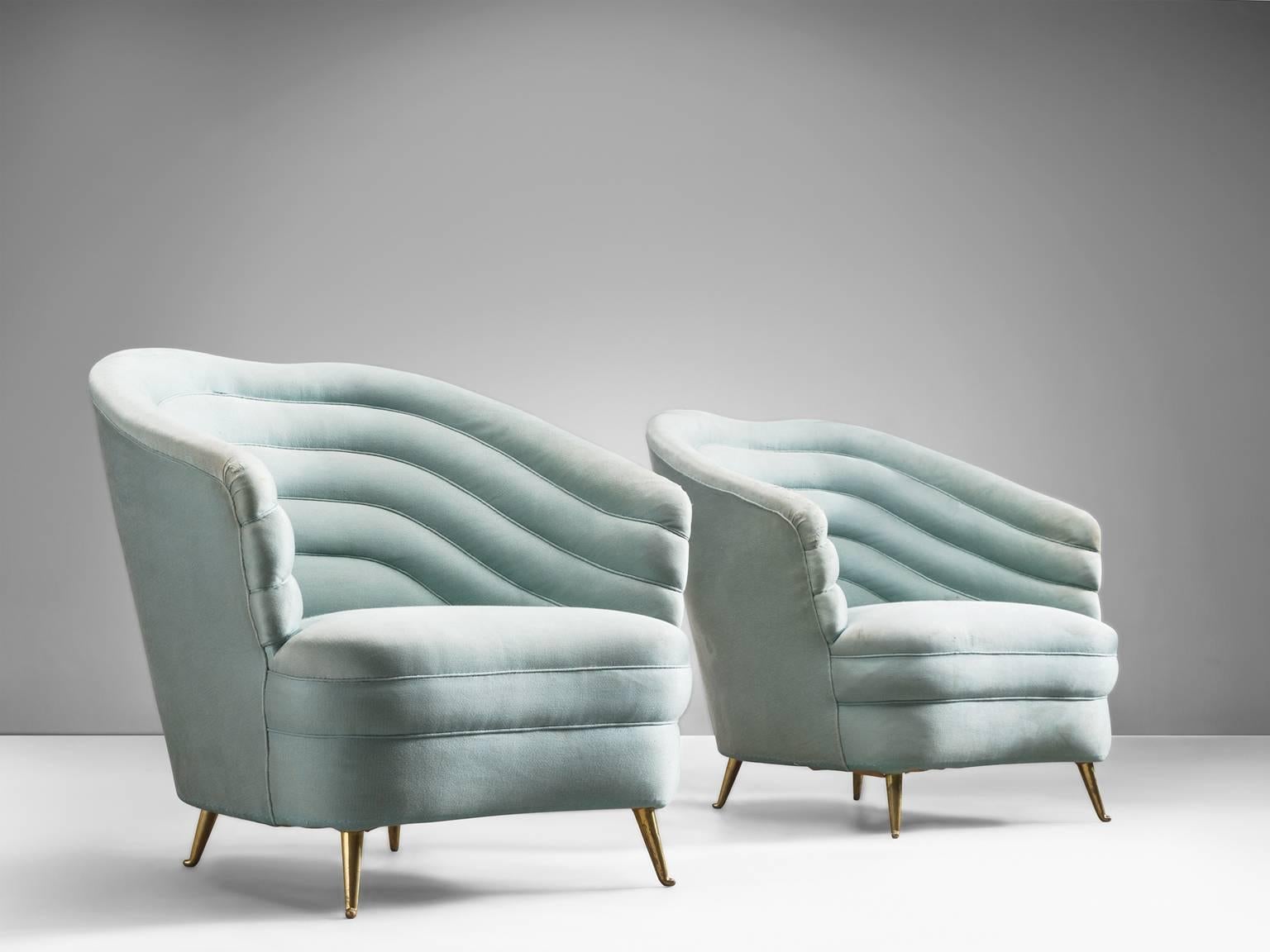 Pair of lounge chairs in velvet and metal, by Andrea Busiri Vici, Italy, 1960s.

These elegant, voluptuous pair of lounge chairs our now shown in an aquamarine, light-blue velvet. The term organic seems to be invented for these chairs as they