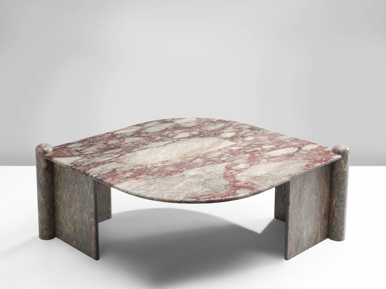 Cocktail table, marble, Italy, 1970s.

This sculptural table has an eye-shaped top and two open triangles that face one another. The circular ends of the base locks the top by means of gravity. The construction is so smoothly designed that