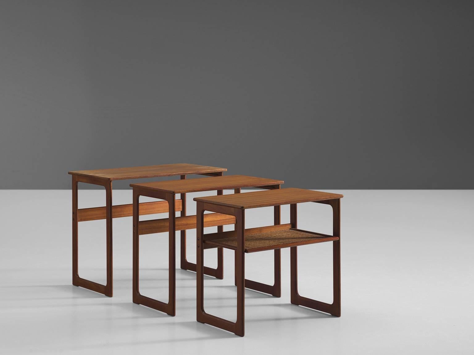 Designed by Johannes Andersen and Illum Wikkelsø for manufacturer CFC Silkeborg.

This gracious set of side tables is designed by Johannes Andersen and Illum Wikkelsø for CFC Silkeborg. The nesting tables feature open rectangles on both side of