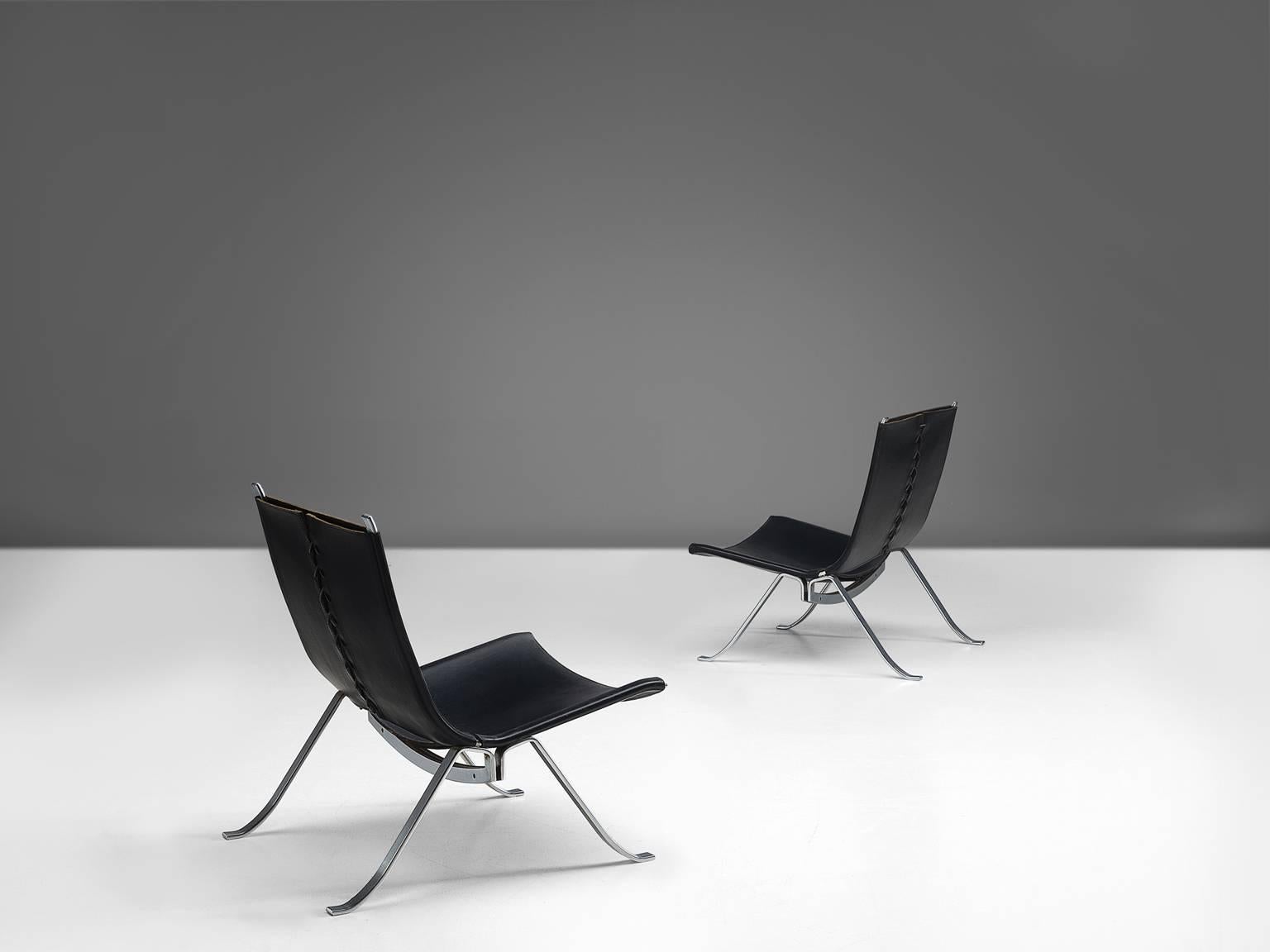 Easy chairs, in chrome and black leather, by Preben Fabricius for Arnold Exclusiv, Denmark 1971. 

A pair of lounge chairs by Fabricius. The very well formed metal frames hold a sturdy brown leather upholstery, tied together with a rope. These very