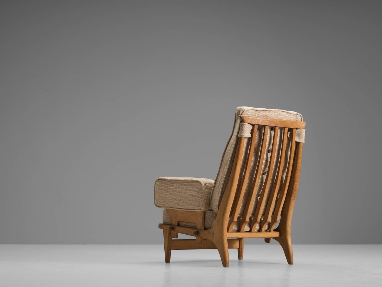 Easy chair, beige fabric, oak, rope, France, 1950s

This sculptural easy chair Guillerme and Chambron are known for their high quality solid oak furniture, from which this is another great example. This comfortable armchair has an interesting open