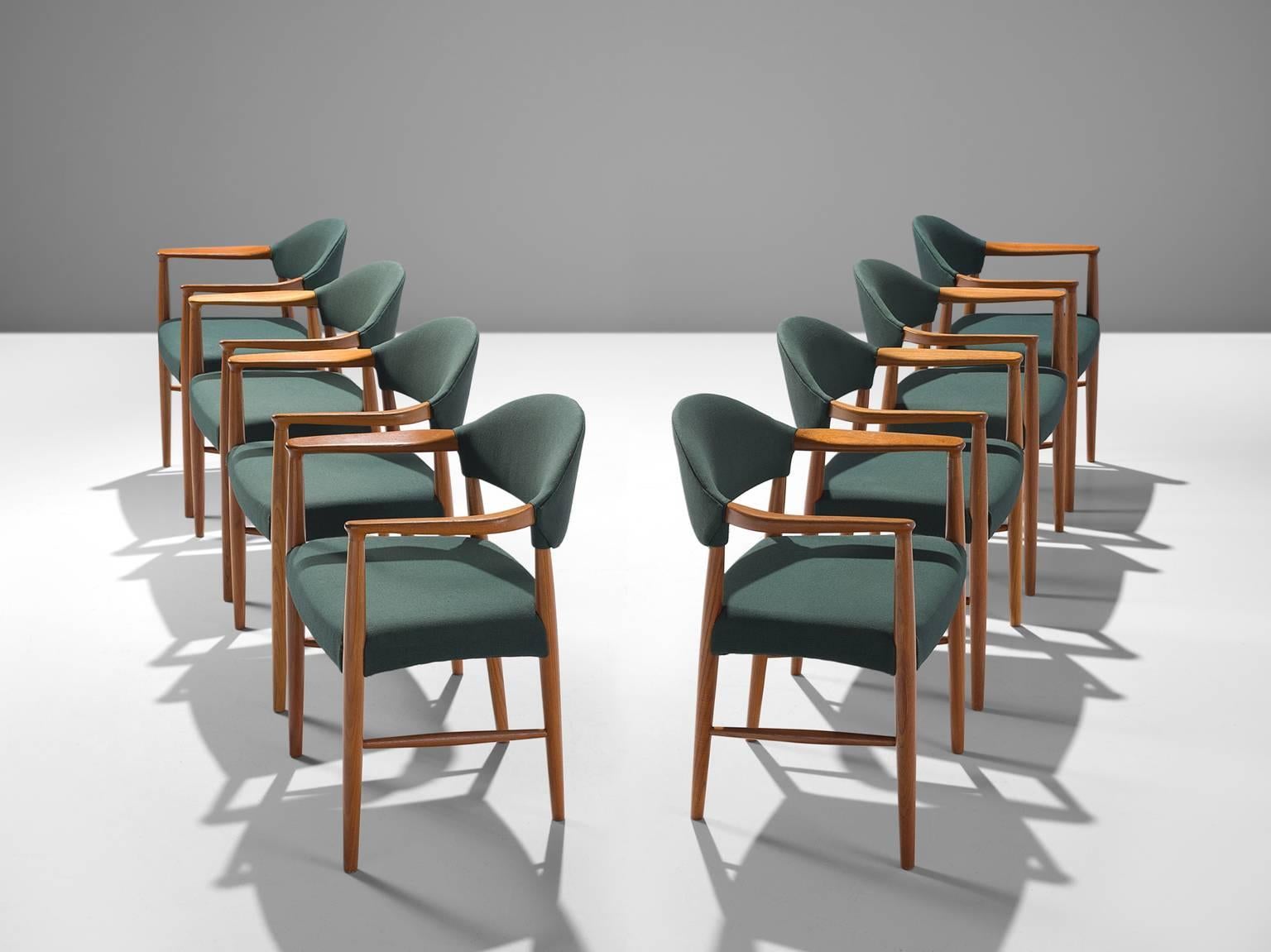 Set of eight armchairs, in teak and green upholstery, Denmark, 1950s. 

Very comfortable dining chairs, due to well-shaped armrests and ergonomic proportions of the back and seat. The sculptural back is very attractive, as the beautifully curved