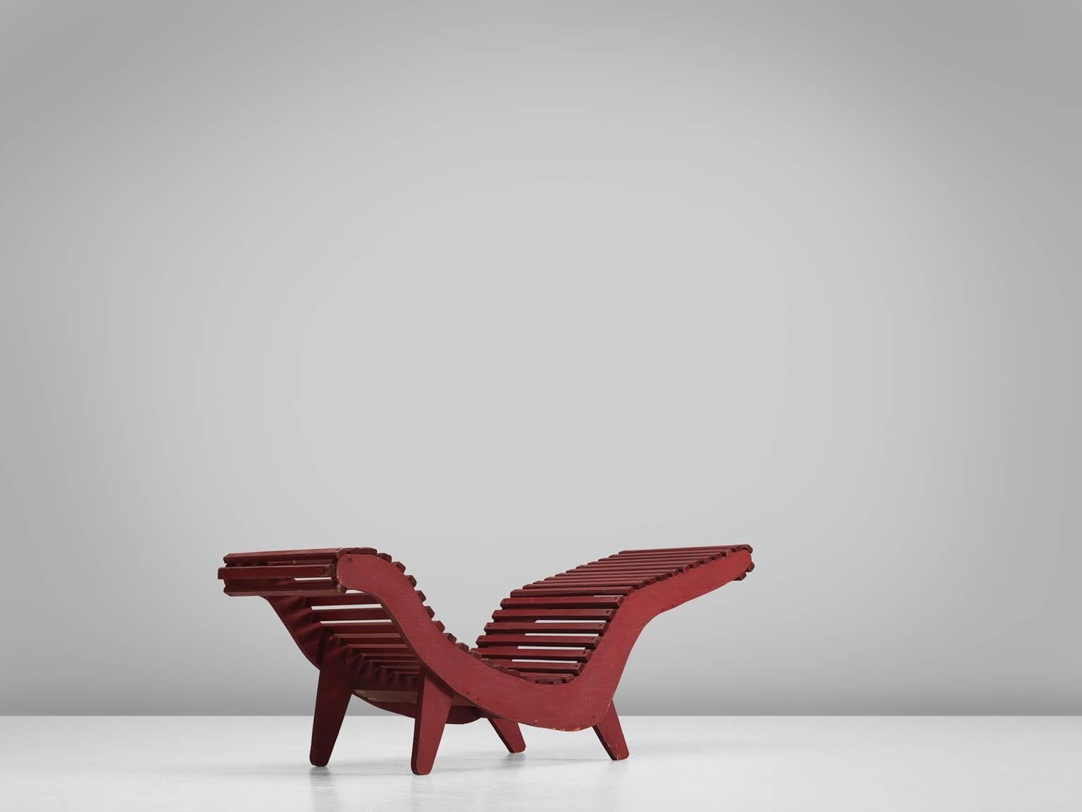 Lounge chair 'C5', deep red wood, plywood, United States, 1950s.

These three red wooden slat ‘C5’ chaise lounges from the 1950s were designed by Klaus Grabe. The core of this design is the curvaceous plywood frame. Plywood was a new material and