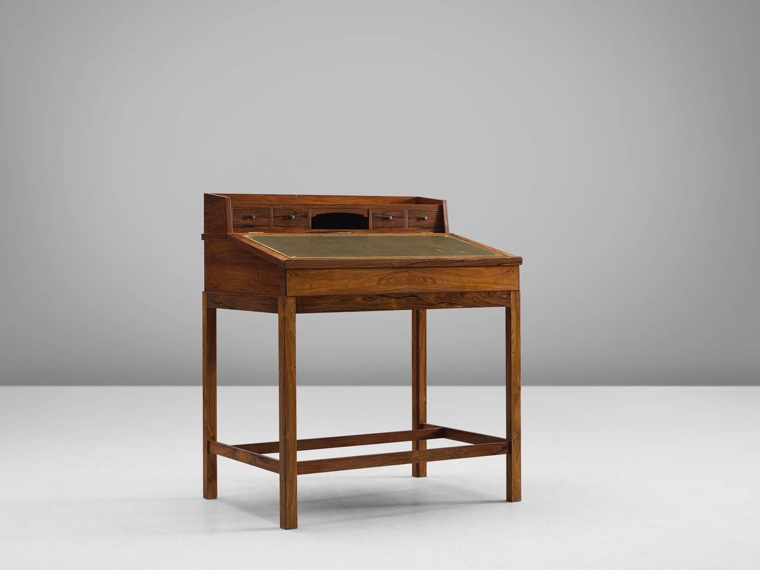 Secretaire, rosewood with olive green leather inlay, Denmark, 1940s

This desk can be used as a luxurious writing desk. The design remains elegant due to the refined shape and combination of materials. Nice brass pulls on the small drawers. Has