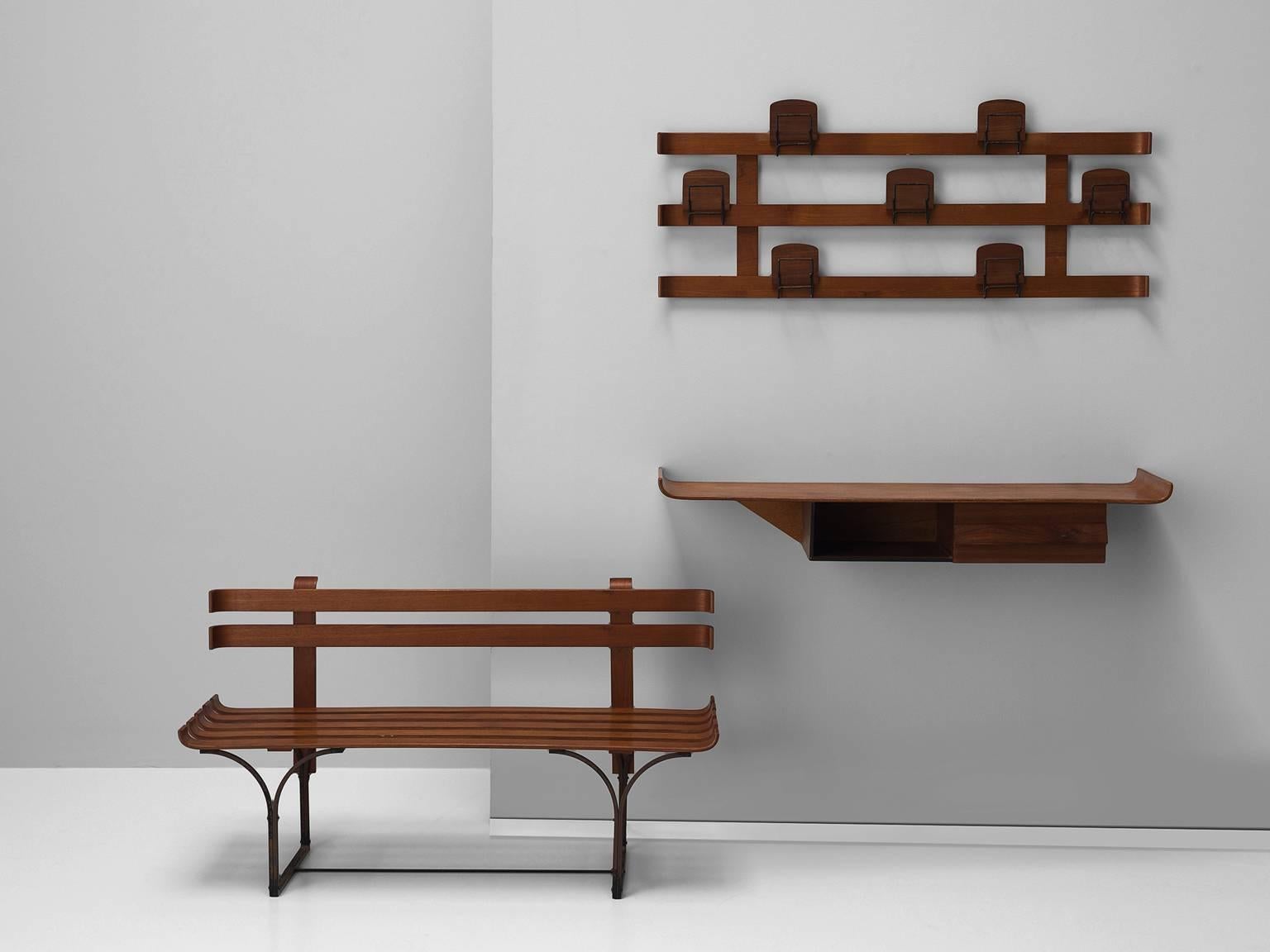 Vestibule set including shelf, bench and coat rack, walnut and steel, Italy, 1950s

This elegant set is an ensemble of a coat rack, shelf and bench. The set is executed in warm walnut and features many Fine details such as the upward bent edges of