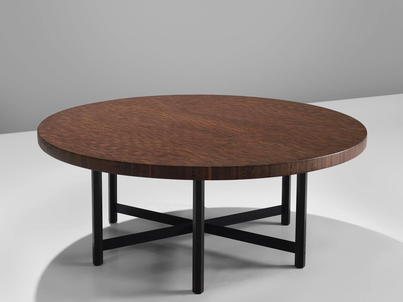 Jules Wabbes for Mobilier Universel, wenge and metal with canon de fusil metal, Belgium, 1960s. 

This large wenge table is part of the midcentury design collection. This large round table one of Jules Wabbes personal favourites. The top is executed