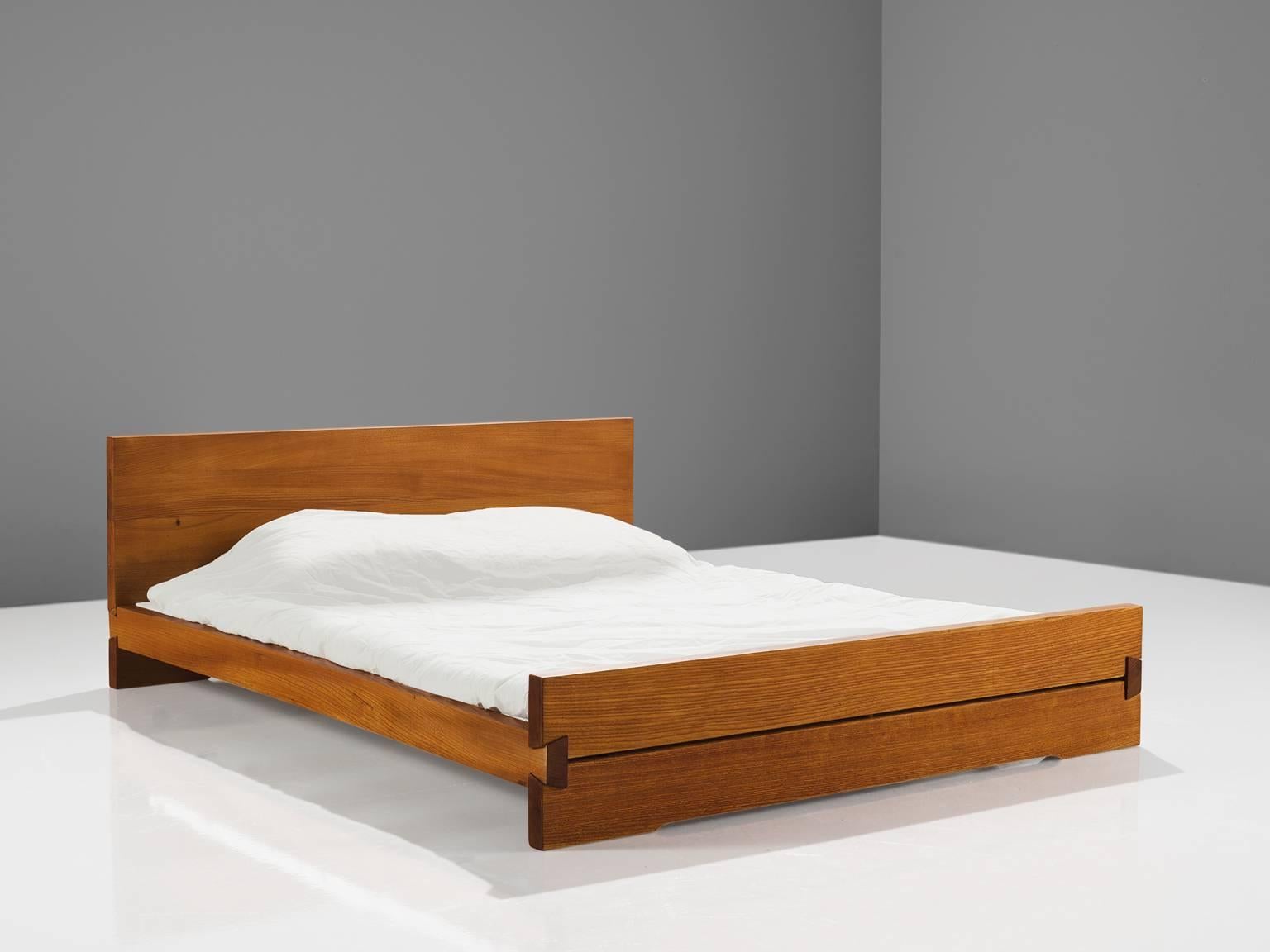Pierre Chapo, 'Louis' bed L02C, elm, France, 1960s

This bed is designed by Pierre Chapo in the 1960s. The bed features the hand-crafted joints that the woodworker Chapo is known for. The bed holds a tall headboard and a lower foot end. The elm
