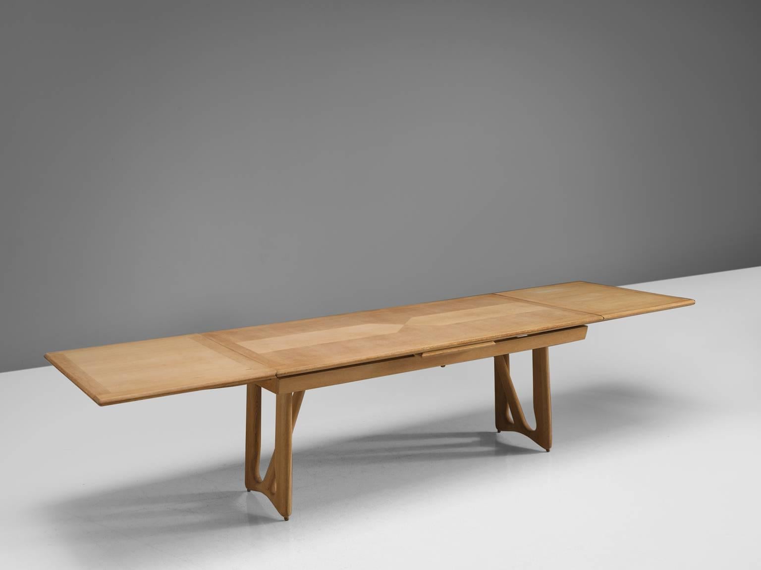 Guillerme et Chambron for Votre Maison, dining table, oak, France, 1965.

This oak 3.20 mt/ 10.5 ft extendable dining table by French designer duo Jacques Chambron. The legs of this table are beautifully shaped and show nice organic forms. The top