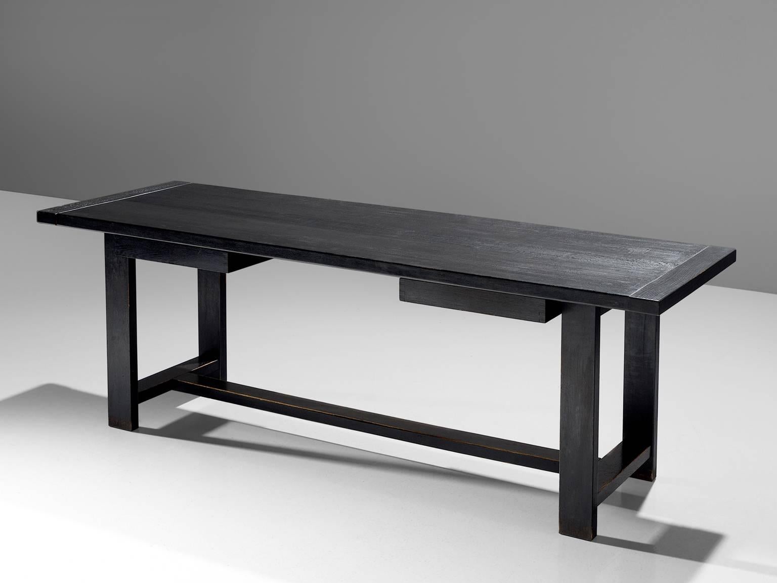 De Coene, stained black console table, Belgium, 1960s.

This dining table is made by De Coene in Belgium. The rectangular top had beveled edges. The table is geometric and minimalist and can be used as a desk or console table. Under the tabletop are