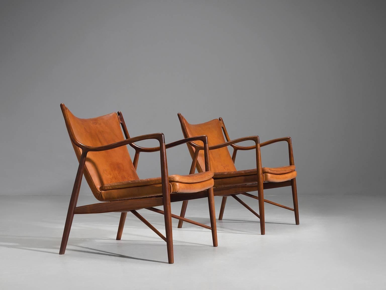 Finn Juhl for Niels Vodder, pair of NV45's, rosewood and cognac leather, Denmark, design 1945, production 1950s. 

This set of early NV45 chairs by Finn Juhl and Niels Vodder are executed in cognac leather and solid rosewood. The master woodworker