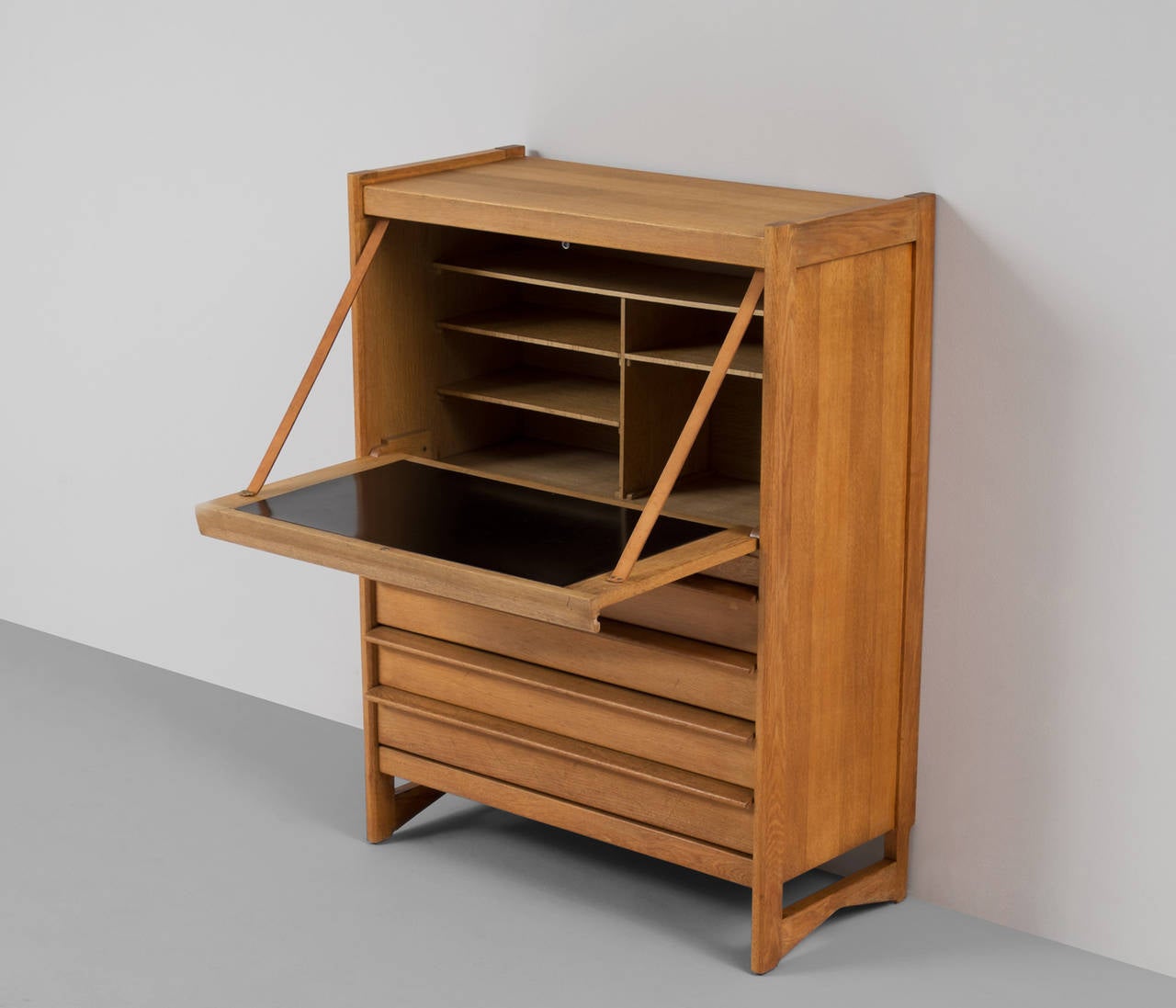 Guillerme and Chambron, high board and desk, oak, France, 1950s

This sculptural cabinet is made by the designer duo Guillerme and Chambron. The piece is executed in solid oak and features sculptural lines and soft edges. The piece holds a folding