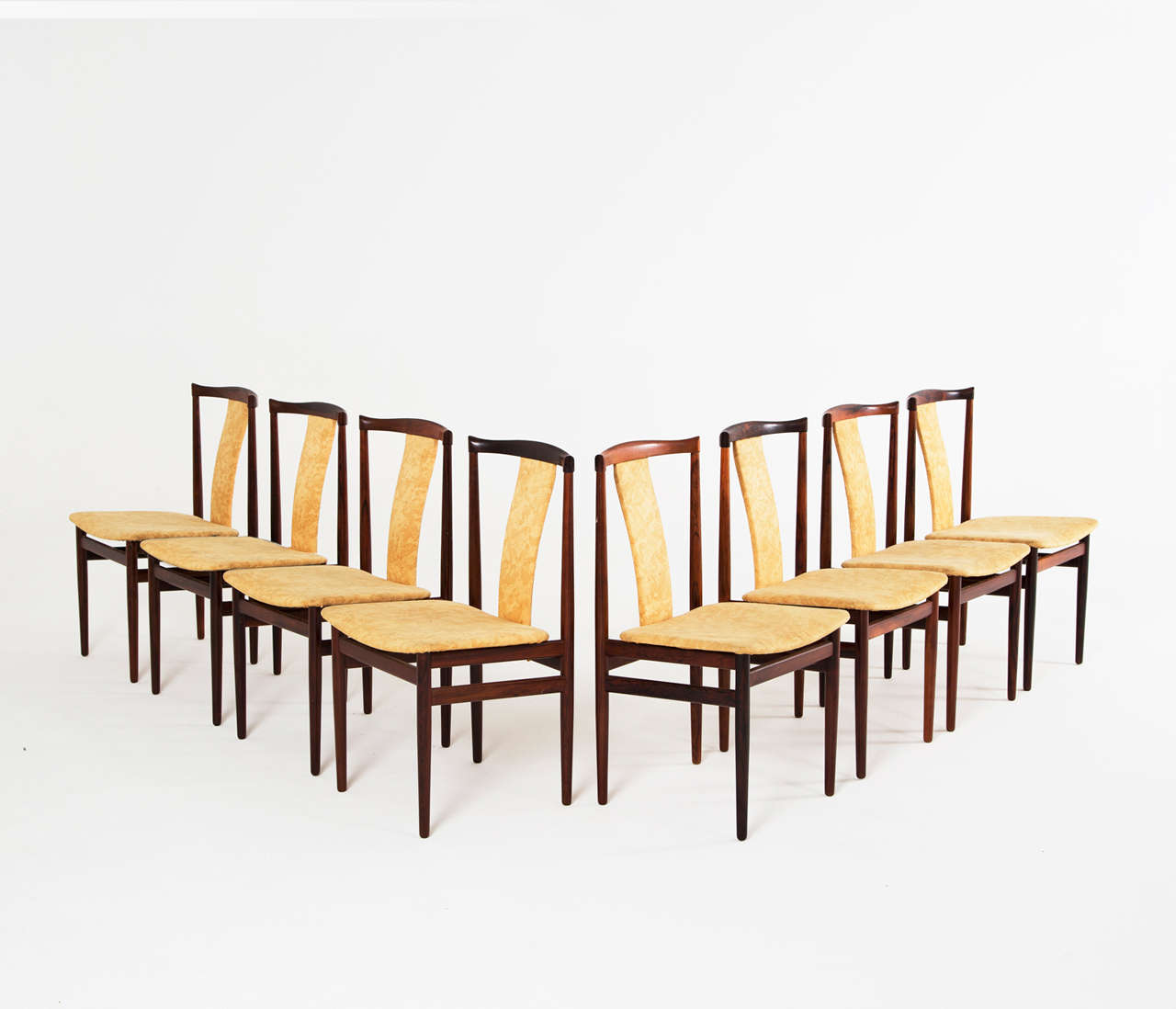 Set of 8 dining chairs, in rosewood and fabric, Denmark 1940s. 

Set of eight very well made Danish solid rosewood dining chairs. The details in these chairs are stunning as seen in the wooden joints and the slightly curved backrest. The upholstery