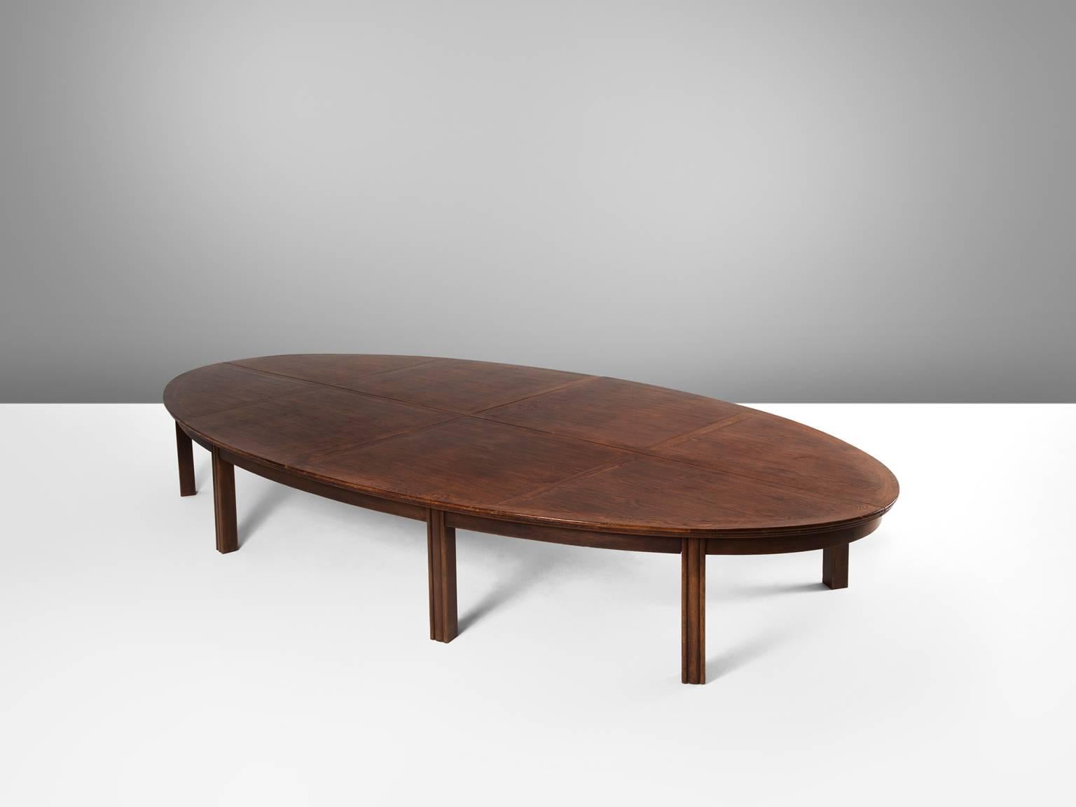 Conference table in oak, the Netherlands, 1950s.

Beautiful aged oval shaped conference or dining table in Art Deco style. The characteristic grain and pattern give this table an authentic and robust look.
 