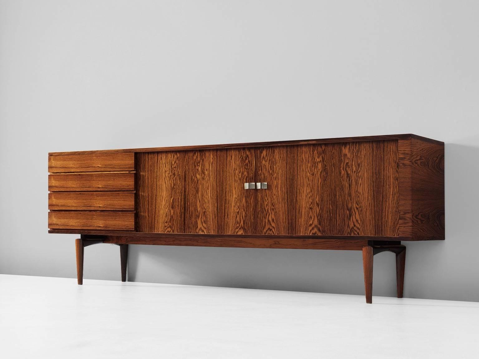 H.W. Klein for Bramin, sideboard, in rosewood, Denmark, 1960s. 

This sideboard is designed by H.W. Klein. This sideboard is examplary for Danish craftsmanship, seen in the details for example the elegant shaped legs. Equipped with two wonderful