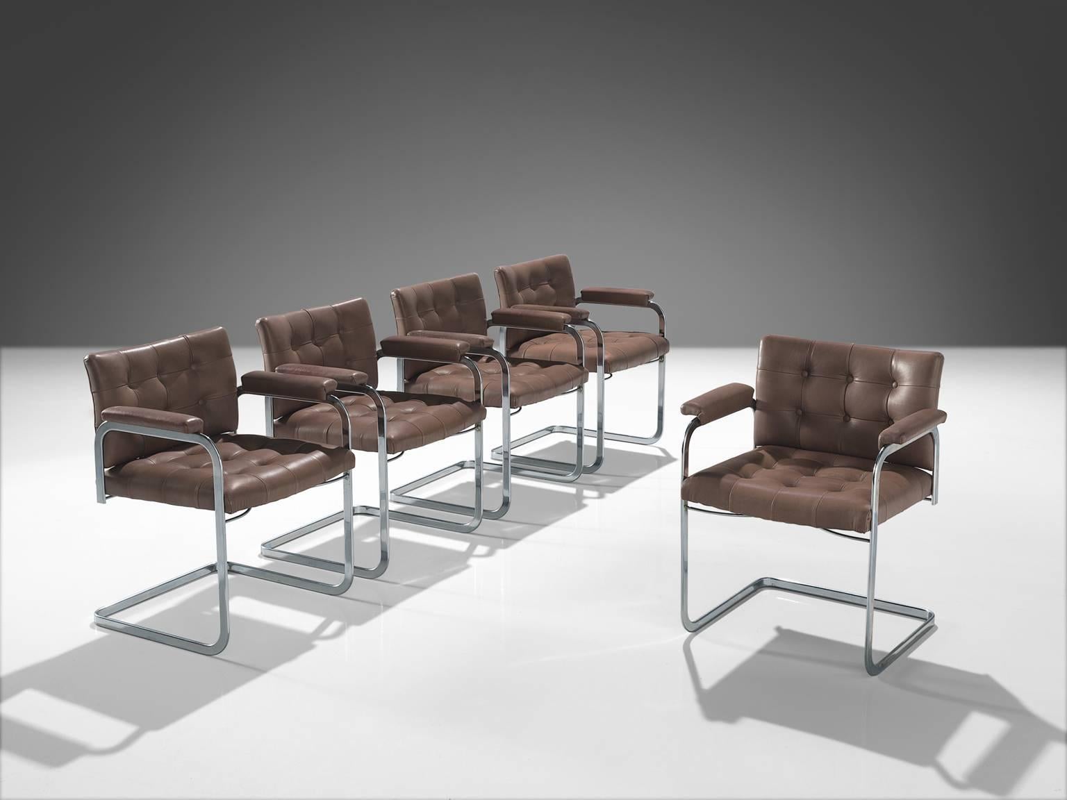 Robert Haussmann and De Sede, set of five 'RH-305', leather and steel, Switzerland, ca. 1950. 

This set of tufted chairs feature a cantilever design and leather padded armchairs. The set is designed by Haussmann for De Sede. The set has a business