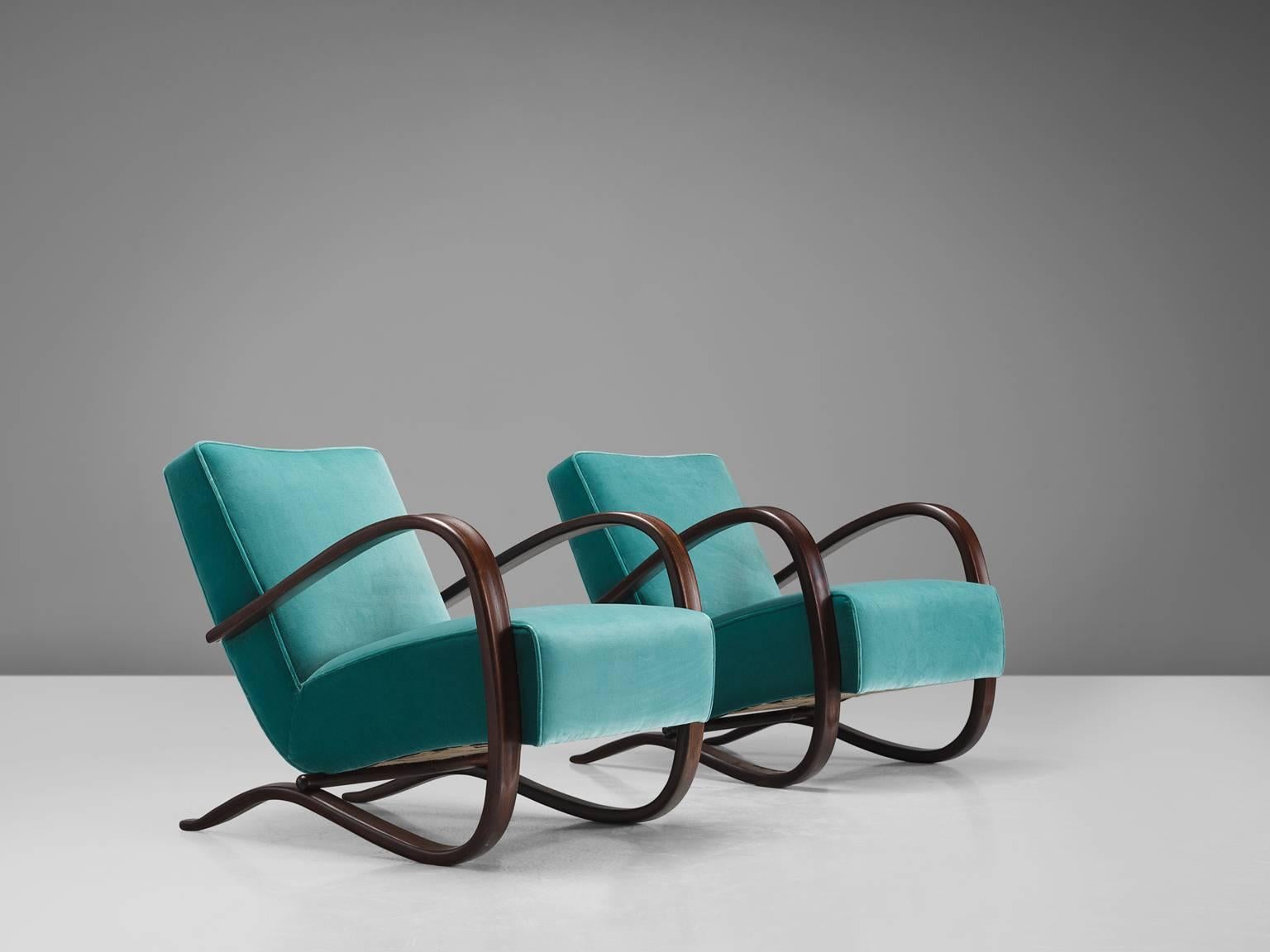 Jindrich Halabala, lounge chairs, green to turquoise velvet and beech, Czech Republic, 1930s. 

This extraordinary pair of Halabala chairs are upholstered with turquoise Kvadrat fabric upholstery. The main feature of this chair by Hindrich Halabala